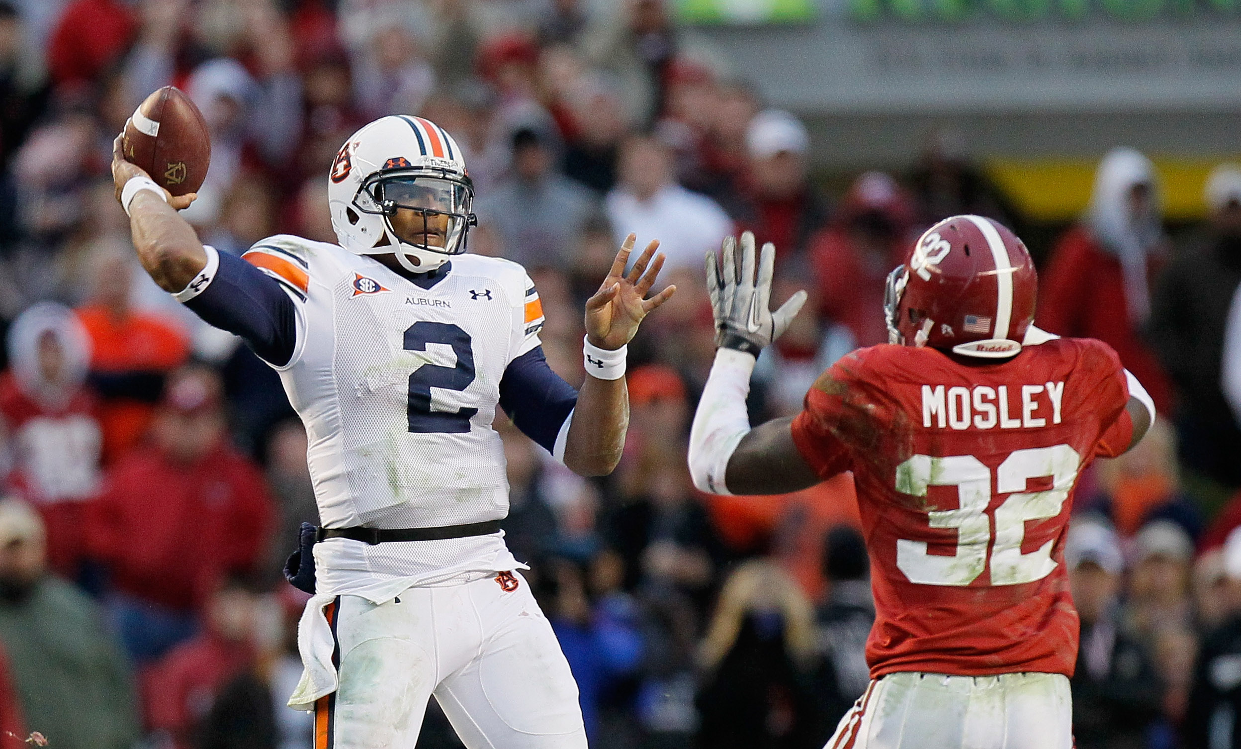 TUSCALOOSA, AL - NOVEMBER 26:  Quarterback Cam Newton #2 of the Auburn Tigers looks to pass against C.J. Mosley #32 of the Alabama Crimson Tide at Bryant-Denny Stadium on November 26, 2010 in Tuscaloosa, Alabama.  (Photo by Kevin C. Cox/Getty Images)