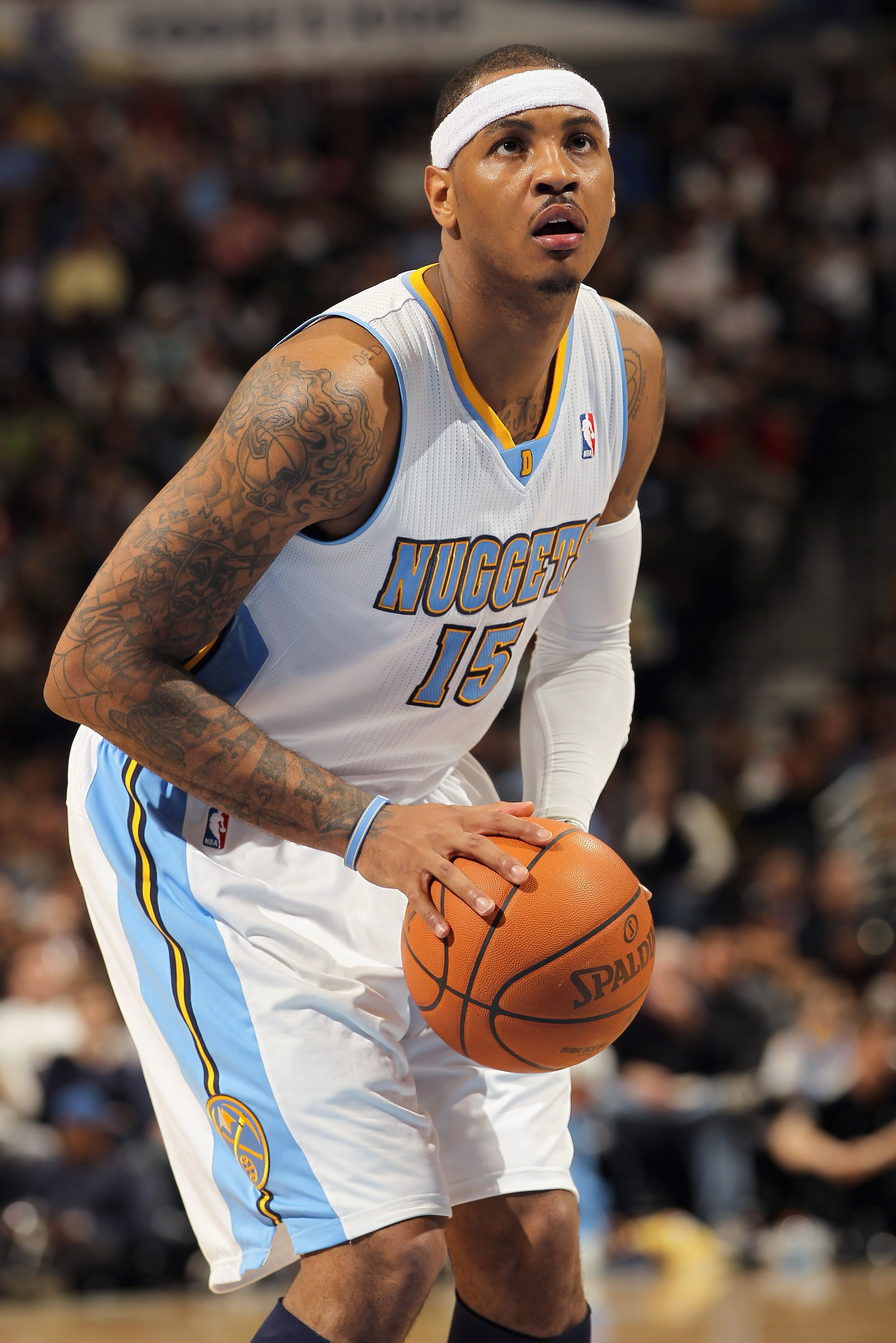 DENVER, CO - FEBRUARY 10:  Carmelo Anthony #15 of the Denver Nuggets takes a free throw against the Dallas Mavericks during NBA action at the Pepsi Center on February 10, 2011 in Denver, Colorado. The Nuggets defeated the Mavericks 121-120. NOTE TO USER: