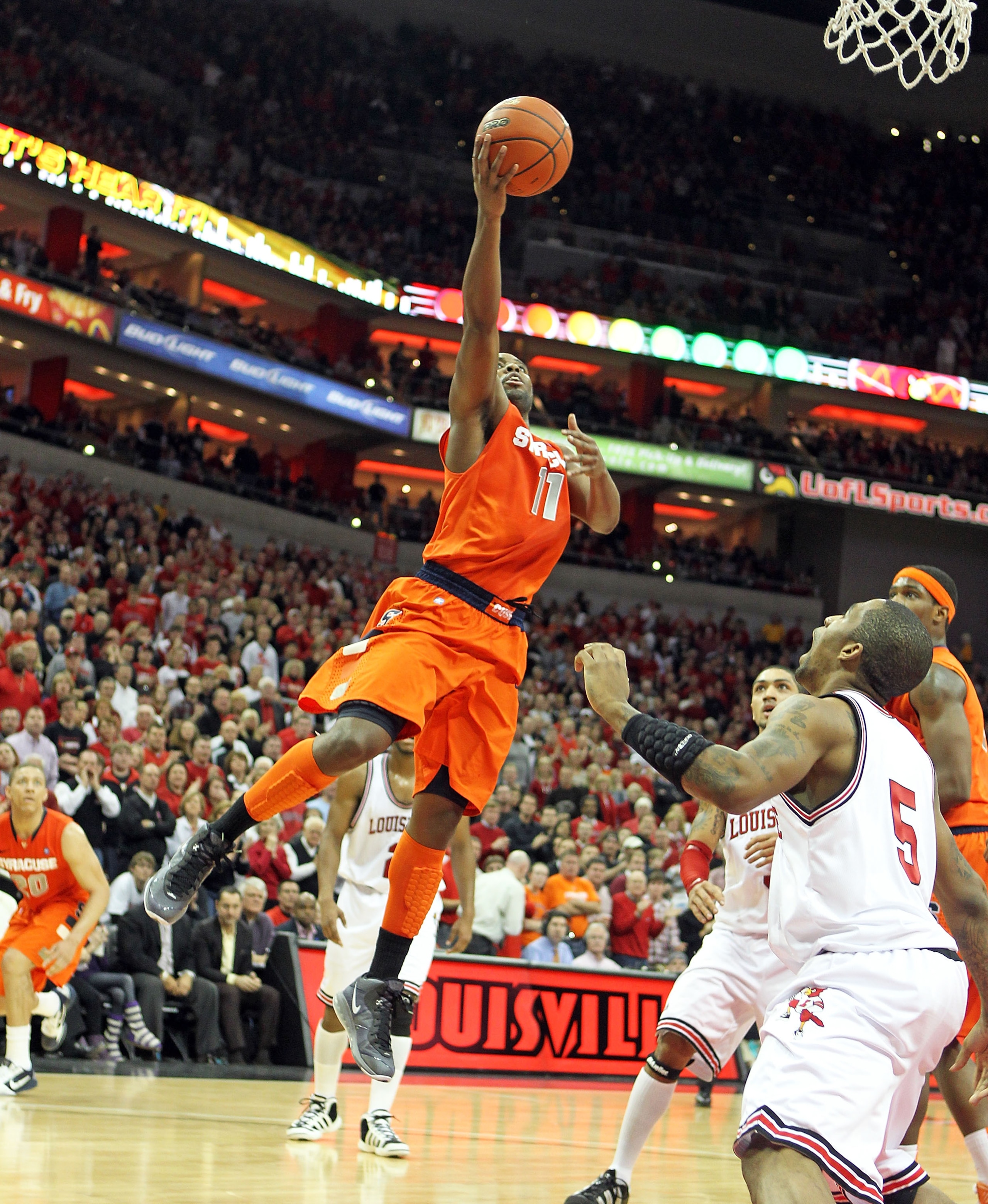 LOUISVILLE, KY - FEBRUARY 12: Scoop Jardine #11 of the Syracuse Orange shoots the ball during the Big East Conference game against the Louisville Cardinals at the KFC Yum! Center on February 12, 2011 in Louisville, Kentucky. Louisville won 73-69. (Phot LOUISVILLE, KY - FEBRUARY 12: Scoop Jardine #11 of the Syracuse Orange shoots the ball during the Big East Conference game against the Louisville Cardinals at the KFC Yum! Center on February 12, 2011 in Louisville, Kentucky. Louisville won 73-69. (Phot