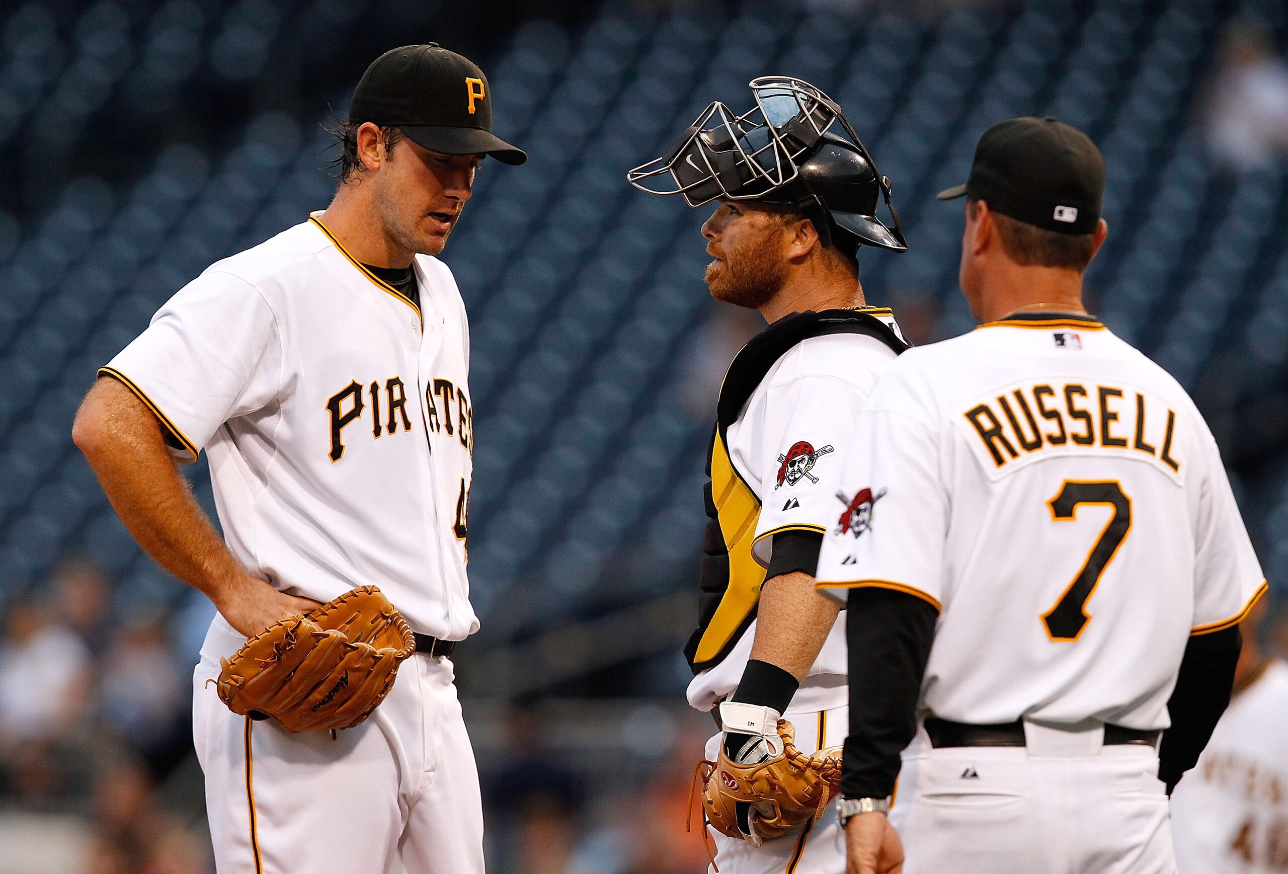 PITTSBURGH - AUGUST 23:  Ross Ohlendorf #49 of the Pittsburgh Pirates talks with Ryan Doumit #41 and manager John Russell #7 before leaving the game with an unknown injury during the game against the St Louis Cardinals on August 23, 2010 at PNC Park in Pi