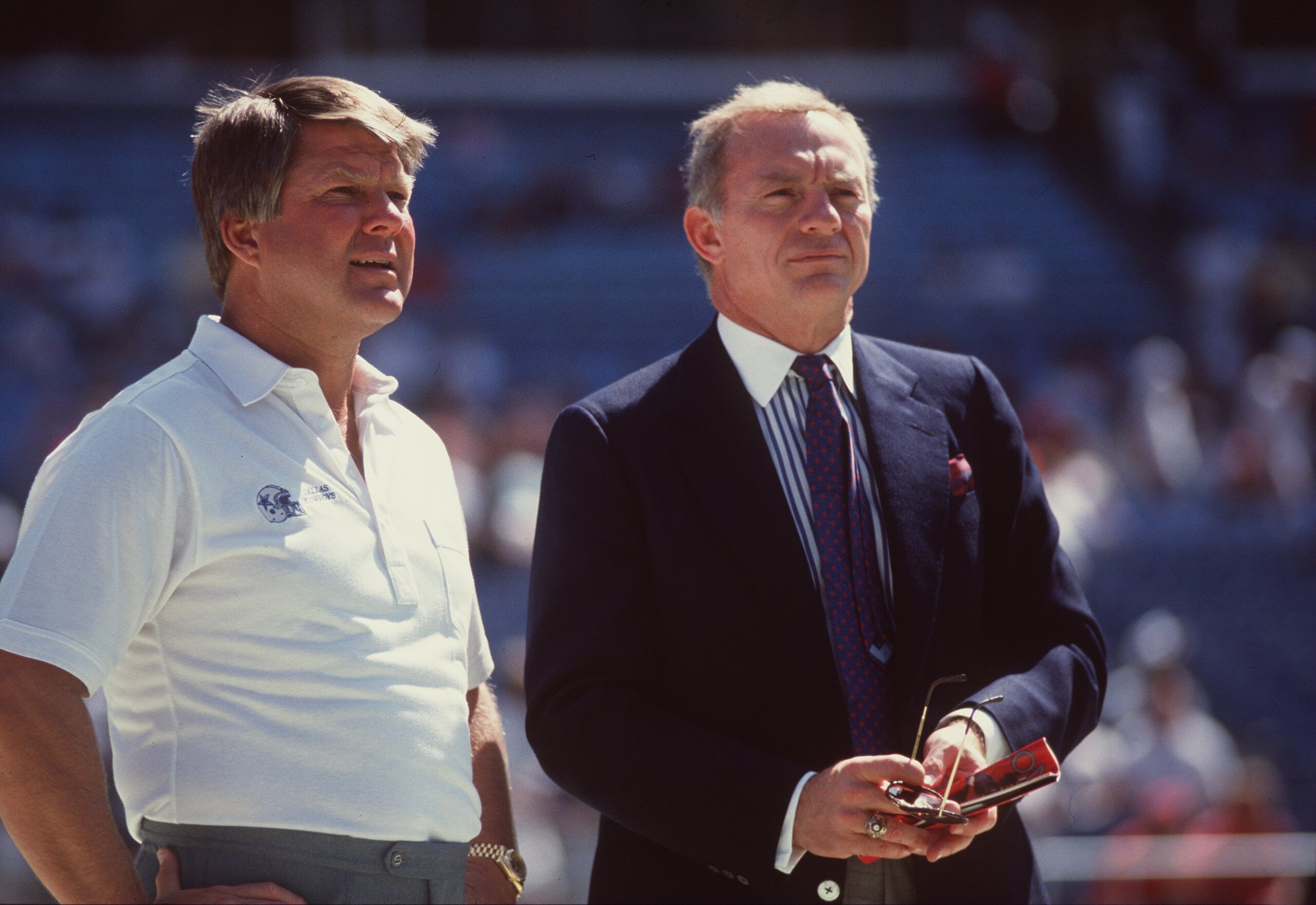 1990: Owner Jerry Jones of the Dallas Cowboys has a conversation with team head coach Jimmy Johnson on the sidelines during pre game warm ups before the Cowboys 27-21 loss to the Atlanta Falcons at Texas Stadium in Irving, Texas. Mandatory Credit: Alls 1990: Owner Jerry Jones of the Dallas Cowboys has a conversation with team head coach Jimmy Johnson on the sidelines during pre game warm ups before the Cowboys 27-21 loss to the Atlanta Falcons at Texas Stadium in Irving, Texas. Mandatory Credit: Alls