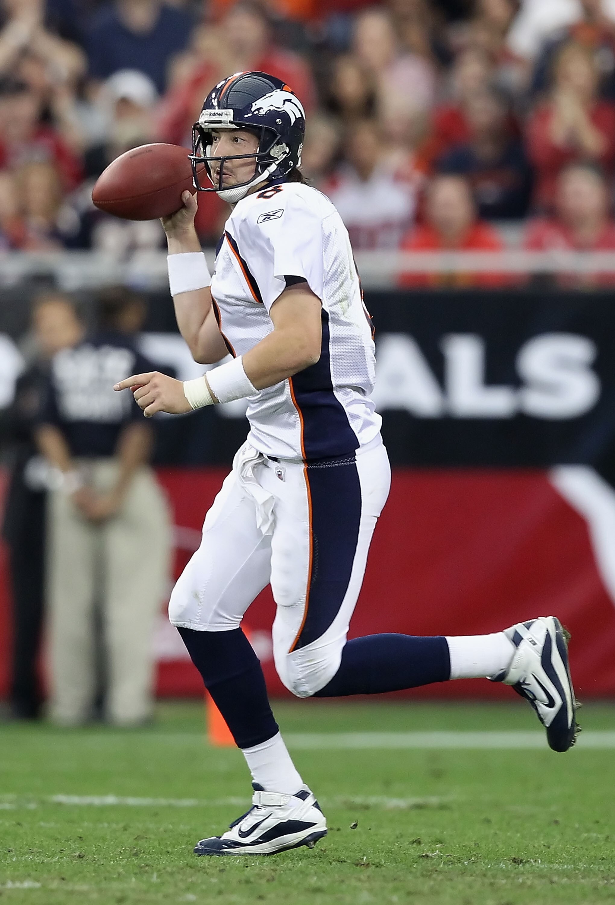 GLENDALE, AZ - DECEMBER 12:  Quarterback Kyle Orton #8 of the Denver Broncos drops back to pass during the NFL game against the Arizona Cardinals at the University of Phoenix Stadium on December 12, 2010 in Glendale, Arizona.  The Cardinals defeated the B