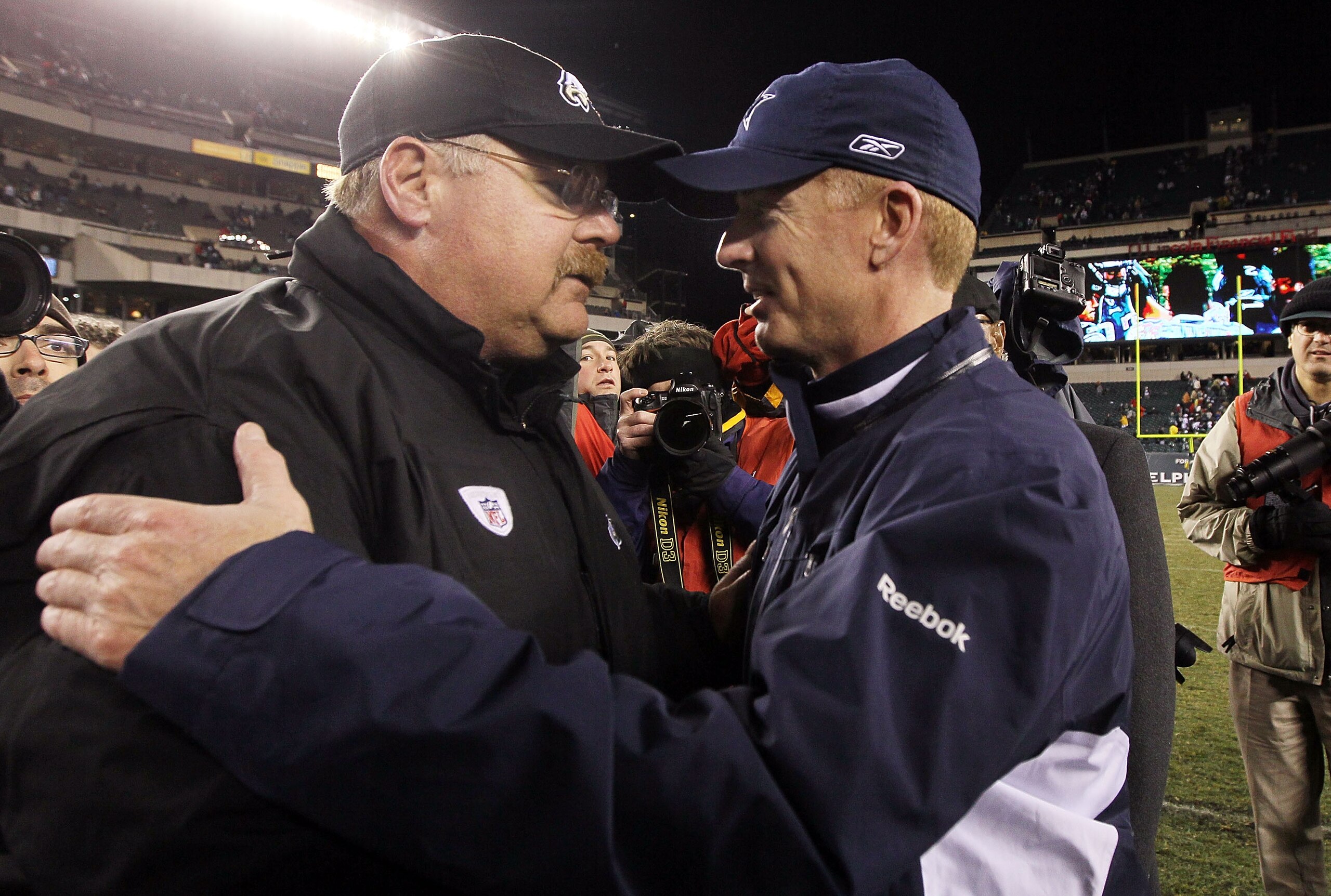 PHILADELPHIA, PA - JANUARY 02: Head coach Andy Reid of the Philadelphia Eagles meets with head coach Jason Garrett of the Dallas Cowboys after their game on January 2, 2011 at Lincoln Financial Field in Philadelphia, Pennsylvania. The Cowboys defeated the PHILADELPHIA, PA - JANUARY 02: Head coach Andy Reid of the Philadelphia Eagles meets with head coach Jason Garrett of the Dallas Cowboys after their game on January 2, 2011 at Lincoln Financial Field in Philadelphia, Pennsylvania. The Cowboys defeated the