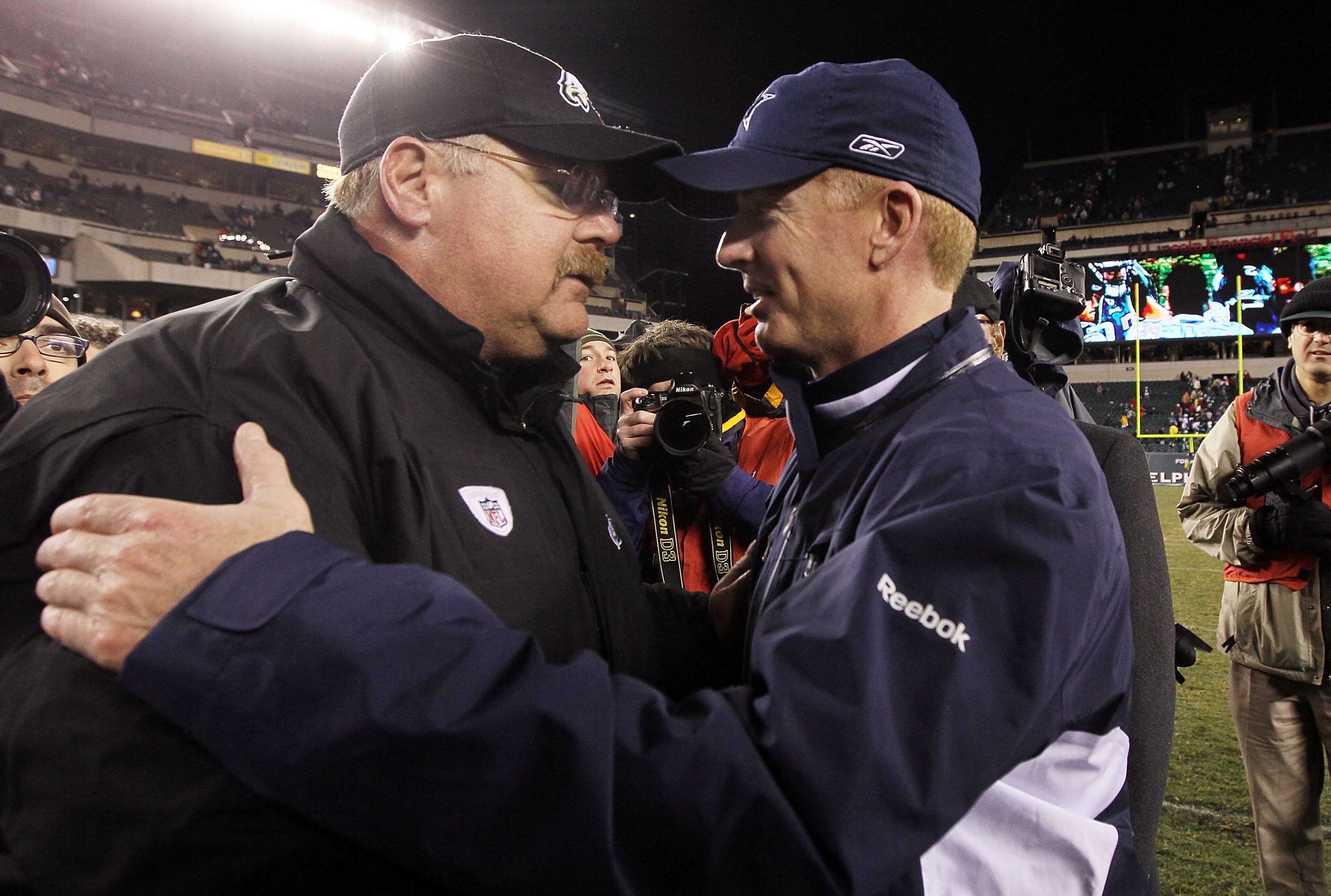 PHILADELPHIA, PA - JANUARY 02: Head coach Andy Reid of the Philadelphia Eagles meets with head coach Jason Garrett of the Dallas Cowboys after their game on January 2, 2011 at Lincoln Financial Field in Philadelphia, Pennsylvania. The Cowboys defeated the
