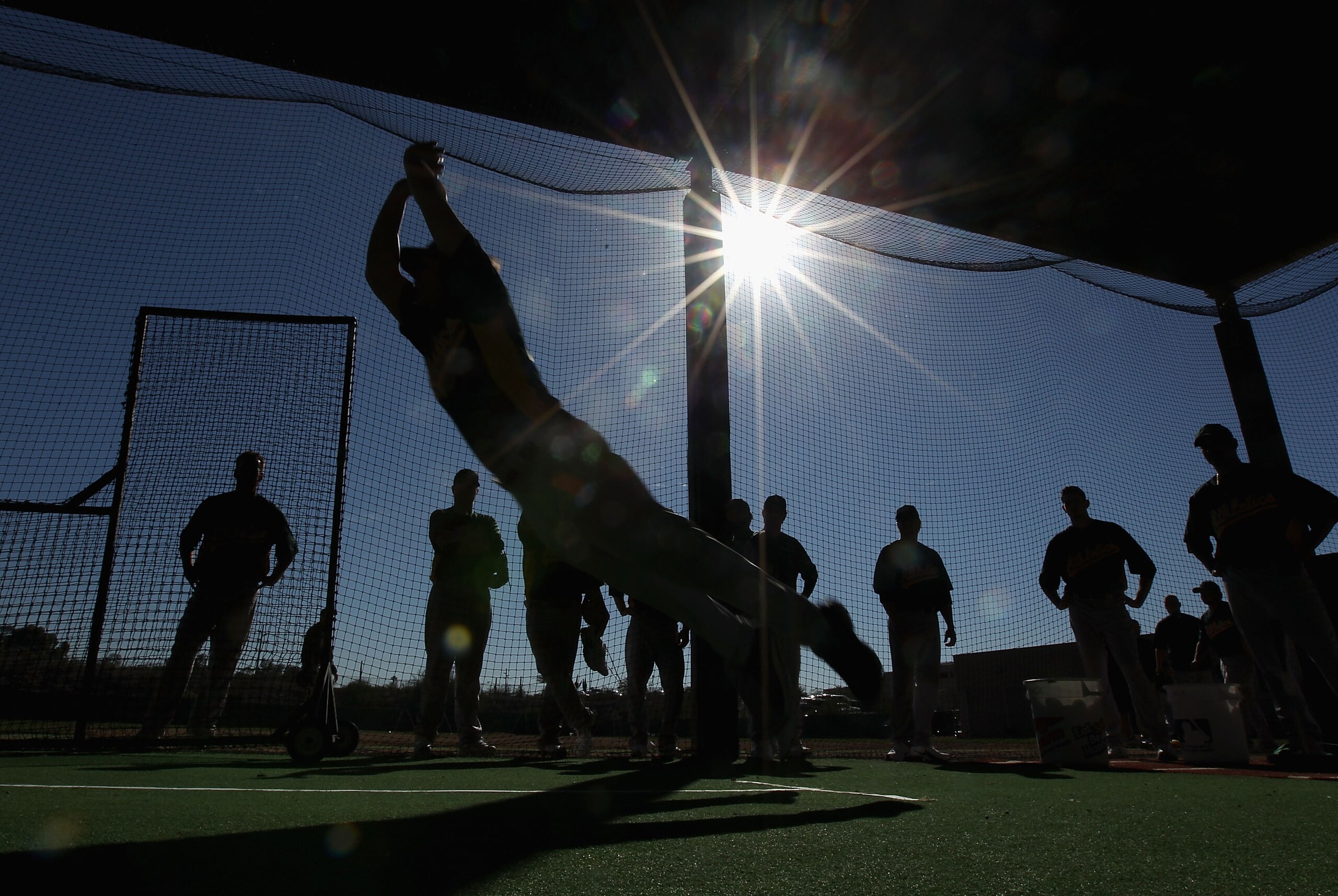 PHOENIX, AZ - FEBRUARY 16:  Pitcher Danny Farquhar #63 of the Oakland Athletics participates in a jumping drill during a MLB spring training practice at Phoenix Municipal Stadium on February 16, 2011 in Phoenix, Arizona.  (Photo by Christian Petersen/Gett