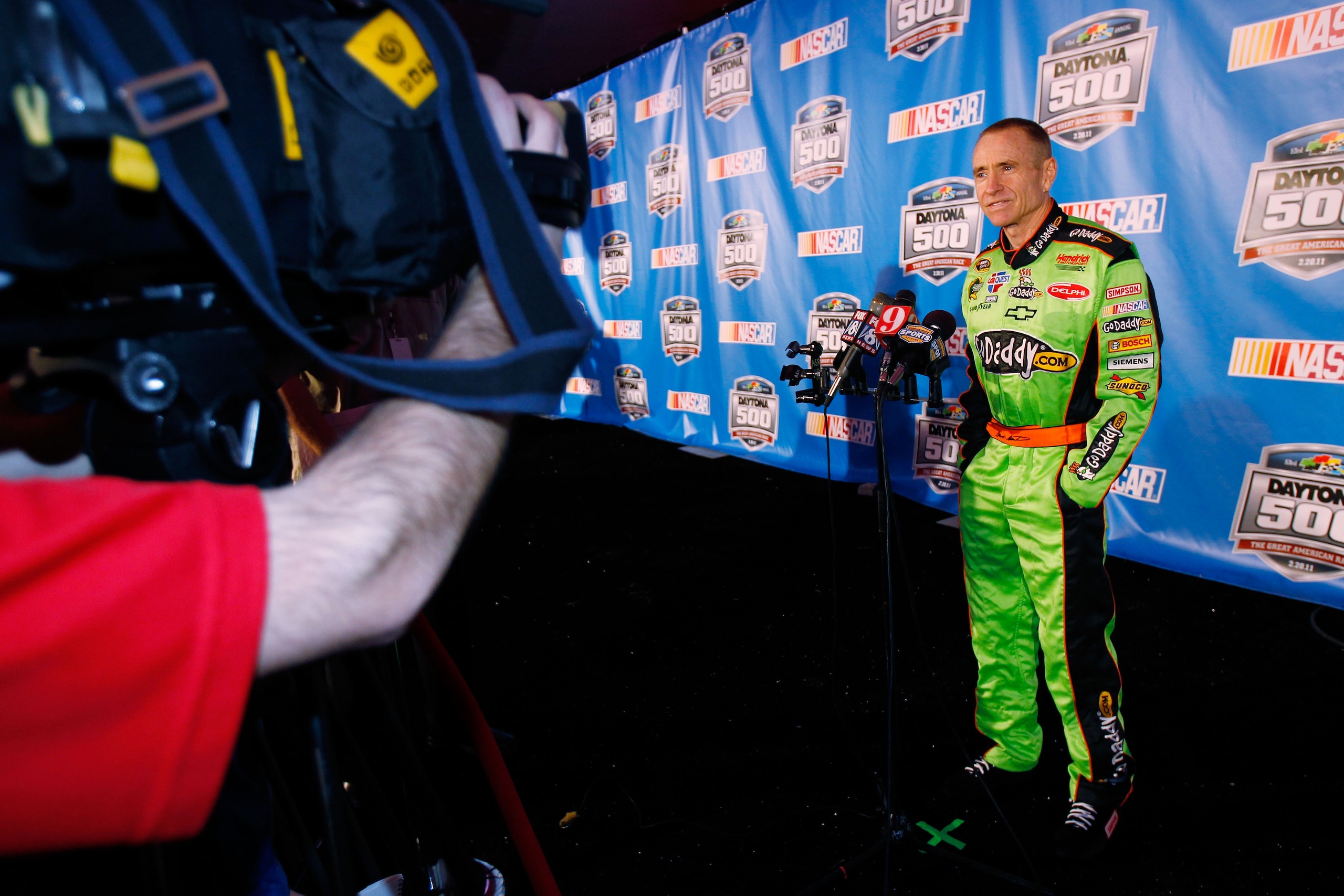 DAYTONA BEACH, FL - FEBRUARY 10: Mark Martin, driver of the #5 GoDaddy.com Chevrolet, speaks to the media during the 2011 NASCAR Media Day at Daytona International Speedway on February 10, 2011 in Daytona Beach, Florida. (Photo by Todd Warshaw/Getty Ima DAYTONA BEACH, FL - FEBRUARY 10: Mark Martin, driver of the #5 GoDaddy.com Chevrolet, speaks to the media during the 2011 NASCAR Media Day at Daytona International Speedway on February 10, 2011 in Daytona Beach, Florida. (Photo by Todd Warshaw/Getty Ima