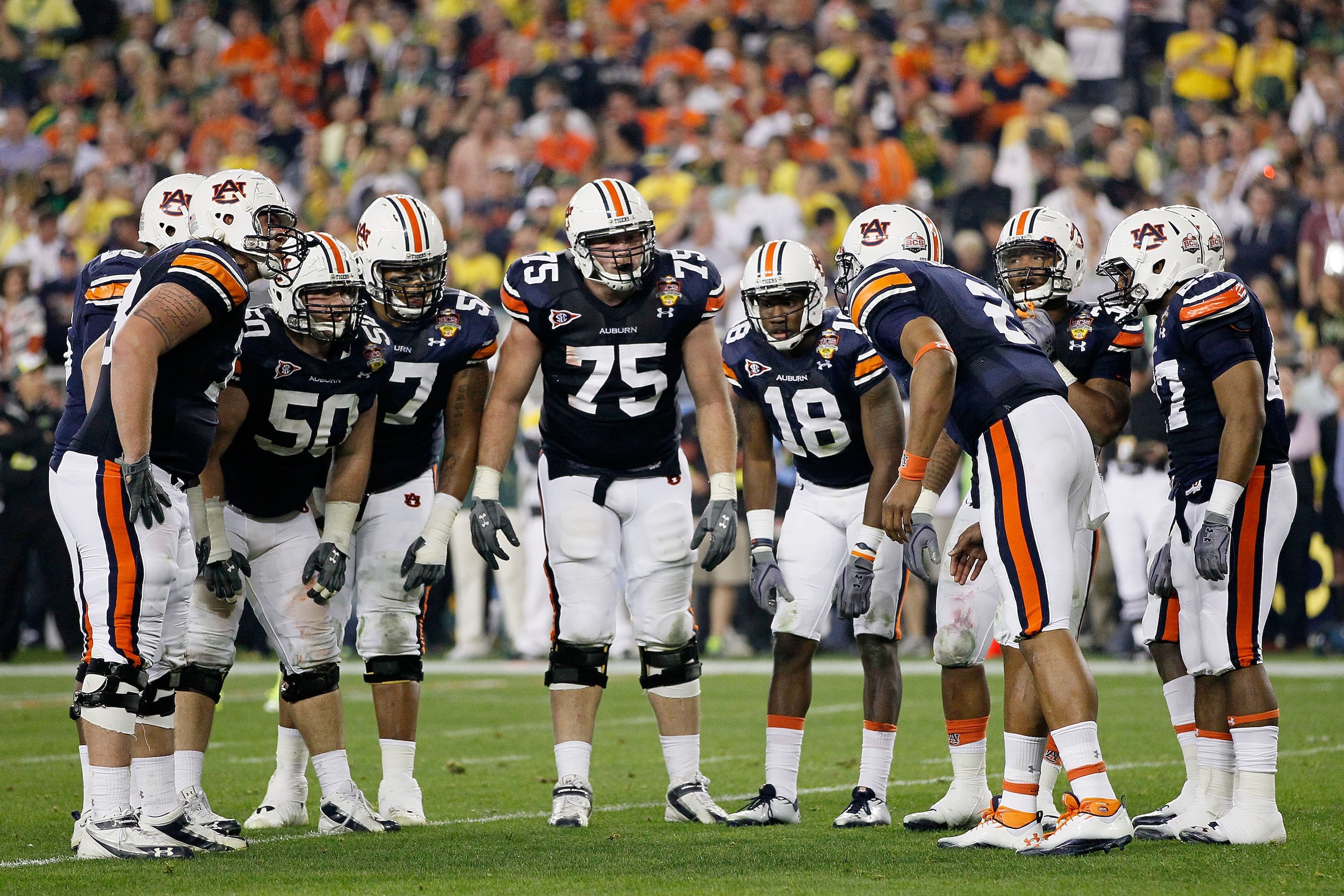 GLENDALE, AZ - JANUARY 10:  The Auburn Tigers huddle against the Oregon Ducks during the Tostitos BCS National Championship Game at University of Phoenix Stadium on January 10, 2011 in Glendale, Arizona.  (Photo by Kevin C. Cox/Getty Images)
