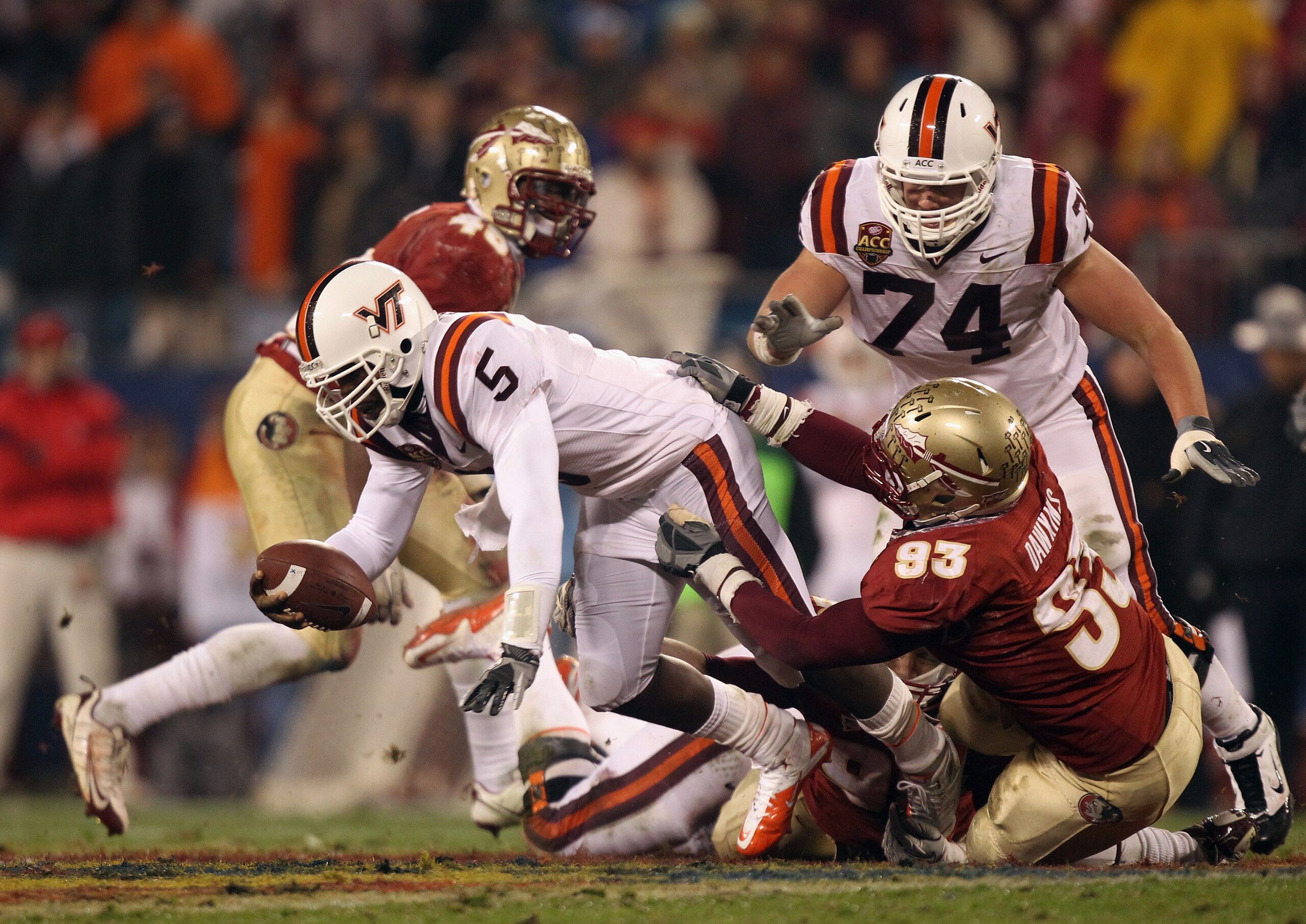 CHARLOTTE, NC - DECEMBER 04:  Everett Dawkins #93 of the Florida State Seminoles tackles Tyrod Taylor #5 of the Virginia Tech Hokies during their game at Bank of America Stadium on December 4, 2010 in Charlotte, North Carolina.  (Photo by Streeter Lecka/G