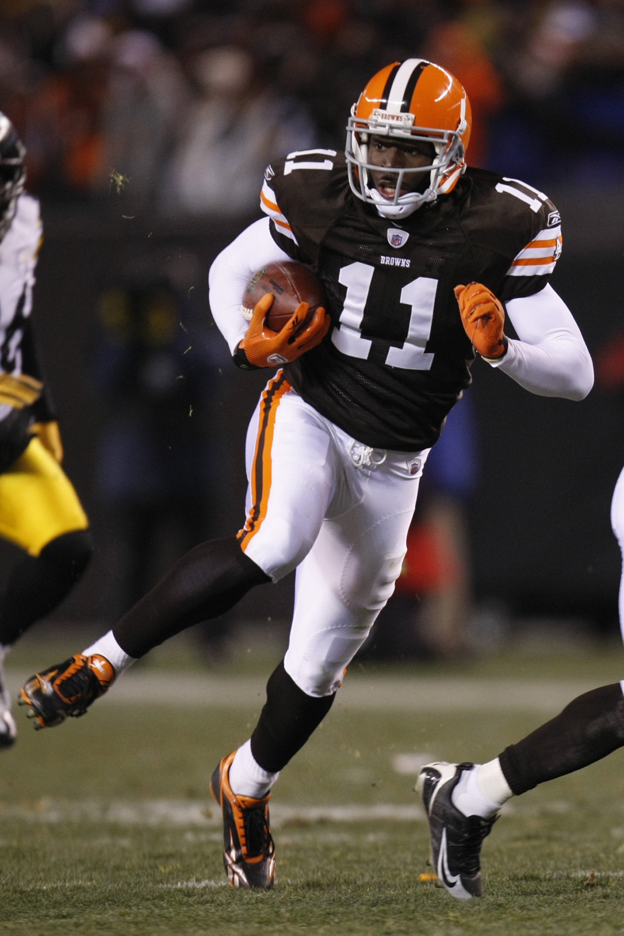 CLEVELAND - DECEMBER 10:  Mohamed Massaquoi #11 of the Cleveland Browns runs with the ball during the game against the Pittsburgh Steelers on December 10, 2009 at Cleveland Browns Stadium in Cleveland, Ohio. Cleveland won the game 13-6.  (Photo by Gregory