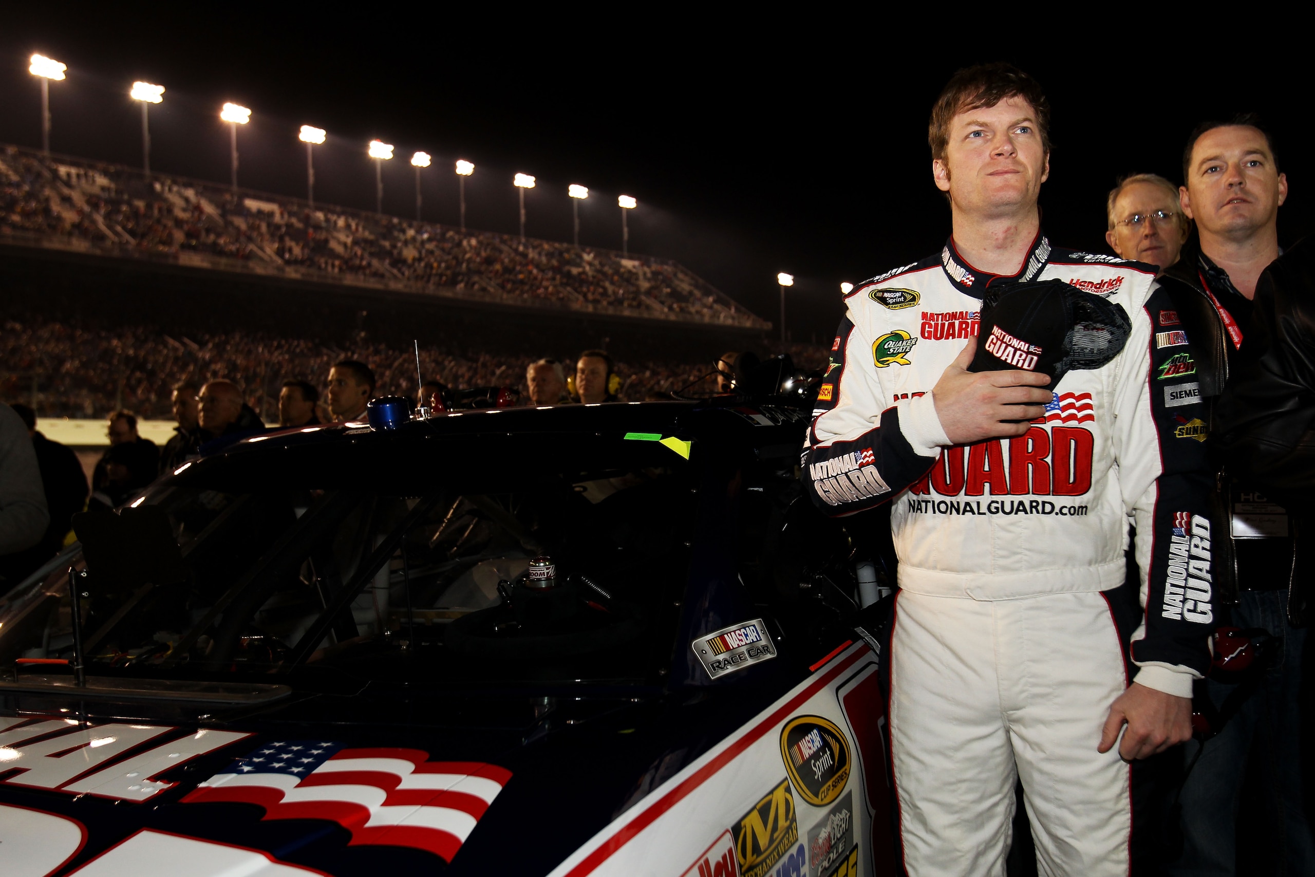 DAYTONA BEACH, FL - FEBRUARY 12: Dale Earnhardt Jr., driver of the #88 National Guard/AMP Energy Chevrolet, stands by his car prior to the NASCAR Budweiser Shootout at Daytona International Speedway on February 12, 2011 in Daytona Beach, Florida. (Photo DAYTONA BEACH, FL - FEBRUARY 12: Dale Earnhardt Jr., driver of the #88 National Guard/AMP Energy Chevrolet, stands by his car prior to the NASCAR Budweiser Shootout at Daytona International Speedway on February 12, 2011 in Daytona Beach, Florida. (Photo