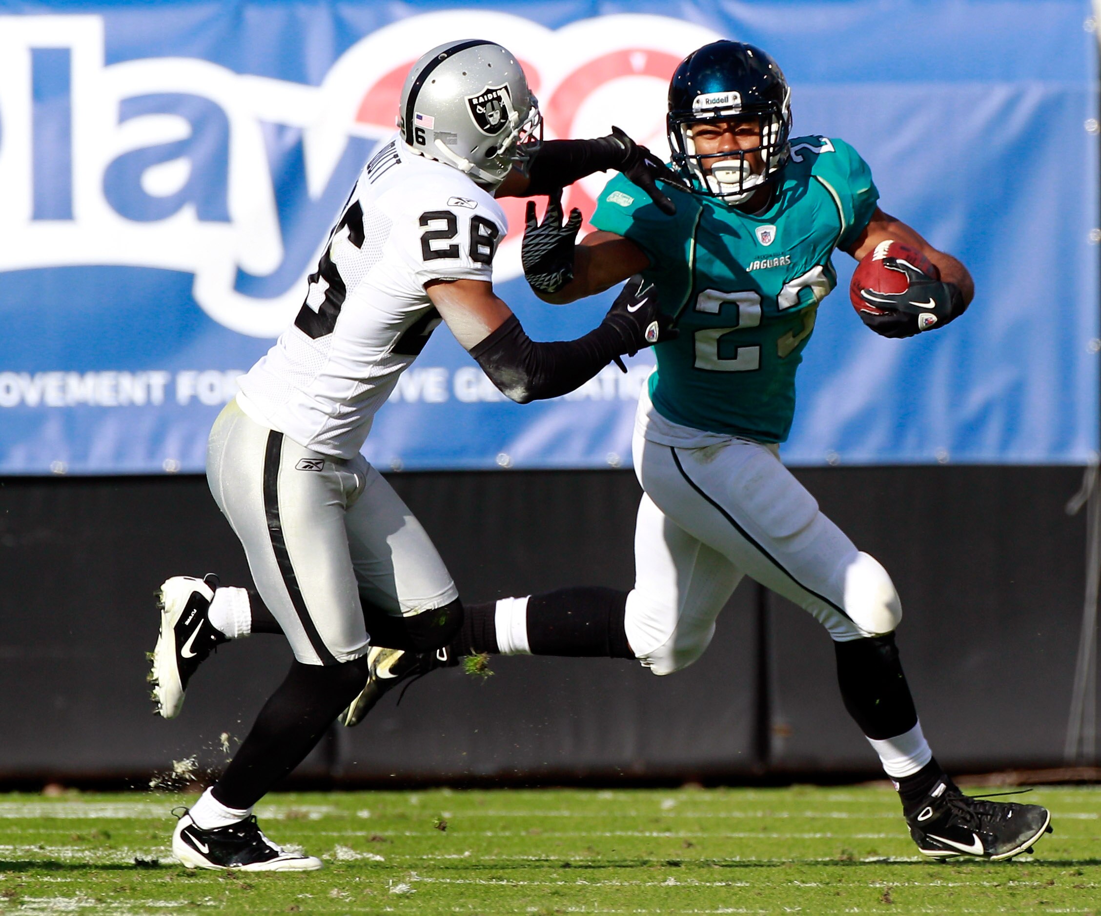 JACKSONVILLE, FL - DECEMBER 12:  Rashad Jennings #23 of the Jacksonville Jaguars rushes against Stanford Routt #26 of the Oakland Raiders during the game at EverBank Field on December 12, 2010 in Jacksonville, Florida.  (Photo by Sam Greenwood/Getty Image
