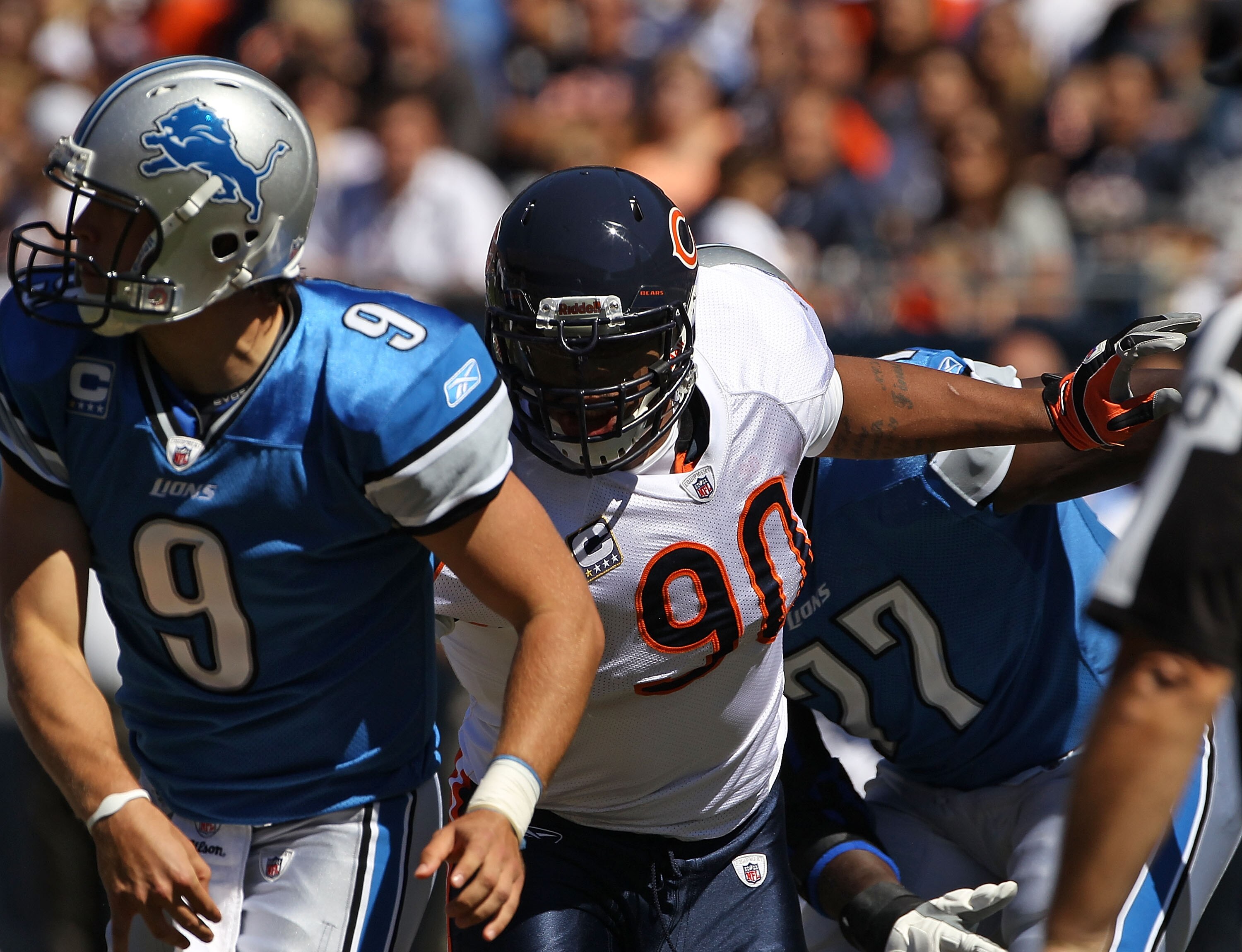 CHICAGO - SEPTEMBER 12: Julius Peppers #90 of the Chicago Bears pressures Matthew Stafford #9 of the Detroit Lions during the NFL season opening game at Soldier Field on September 12, 2010 in Chicago, Illinois. The Bears defeated the Lions 19-14. (Photo b