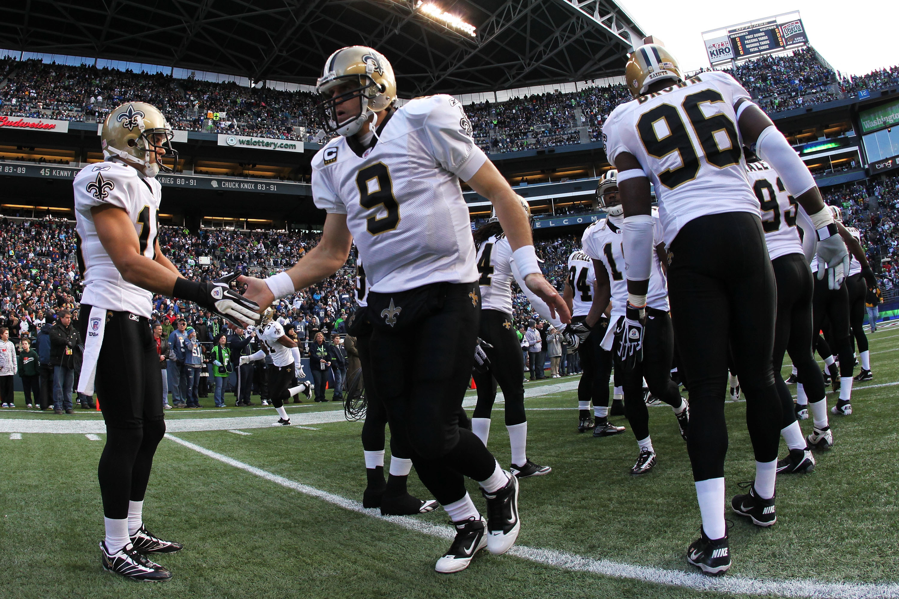 SEATTLE, WA - JANUARY 08:  Quarterback Drew Brees #9 of the New Orleans Saints is introduced before their game against the Seattle Seahawks during the 2011 NFC wild-card playoff game at Qwest Field on January 8, 2011 in Seattle, Washington.  (Photo by Ott
