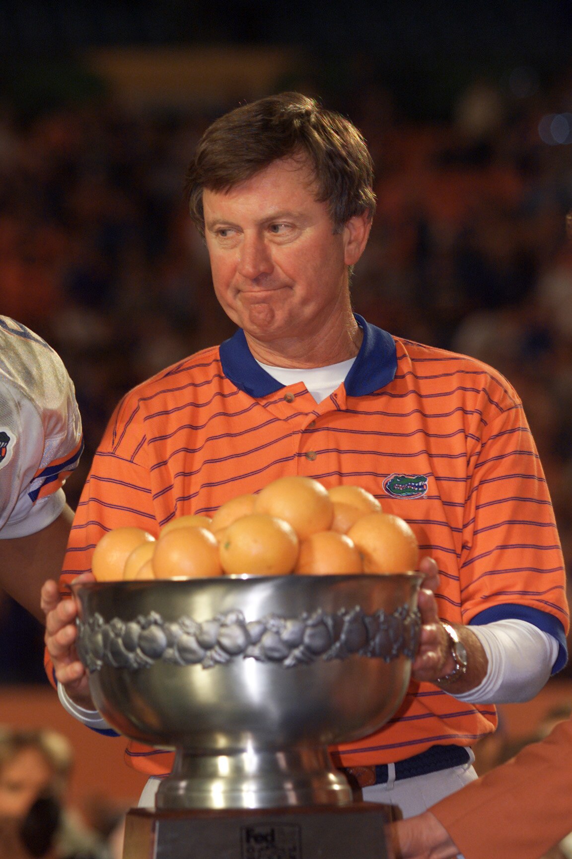 02 Jan 2002:  Head coach Steve Spurrier of Florida receive the FedEx Orange Bowl trophy after the Orange Bowl against Maryland at Pro Player Stadium in Miami, Florida.  Florida won 56-23. DIGITAL IMAGE Mandatory Credit: Eliot Schechter/Getty Images