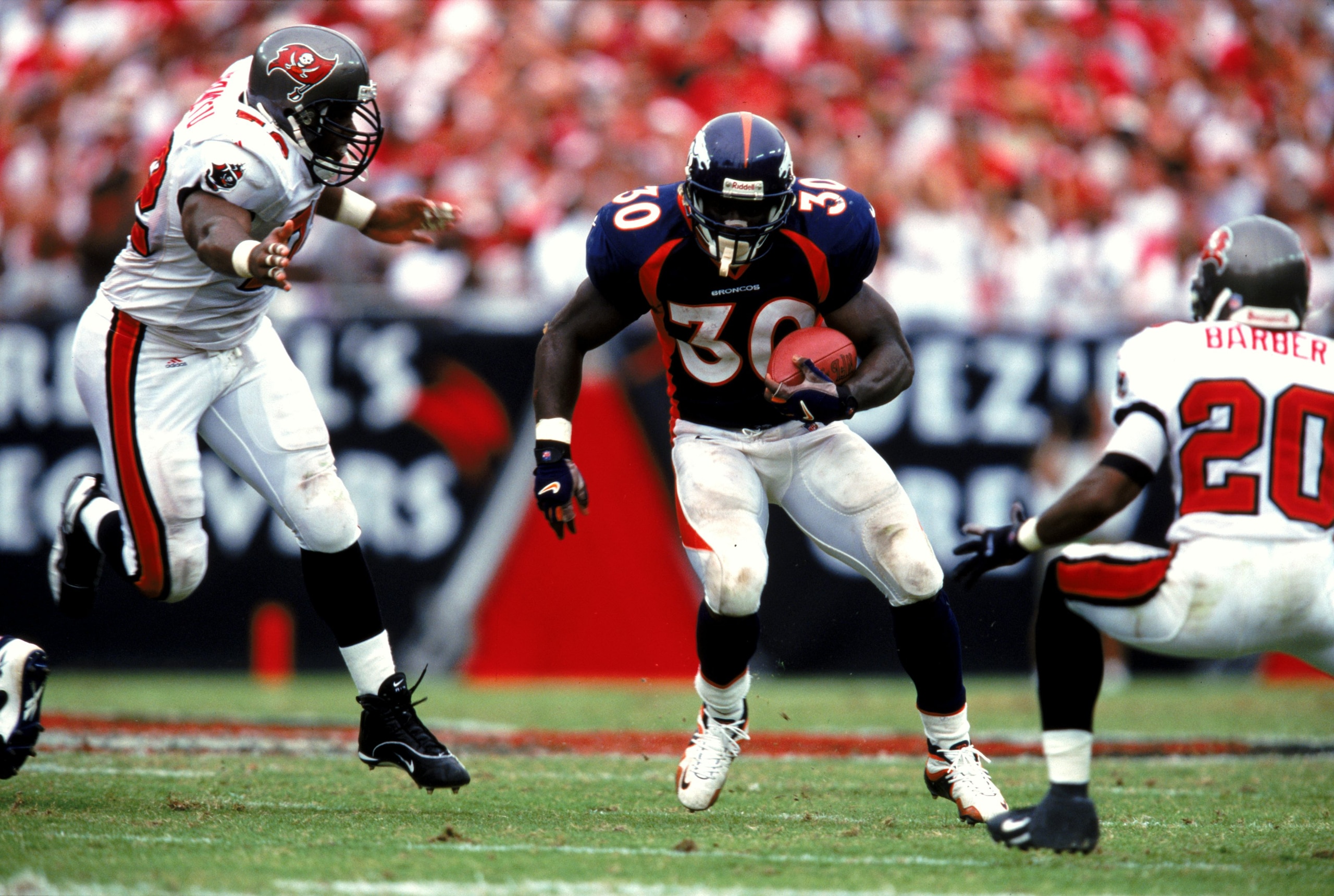 26 Sep 1999: Terrell Davis #30 of the Denver Broncos carries the ball during the game against the Tampa Bay Buccaneers at the Raymond James Stadium in Tampa Bay, Florida. The Buccaneers defeated the Broncos 13-10. Mandatory Credit: Andy Lyons  /Allsport