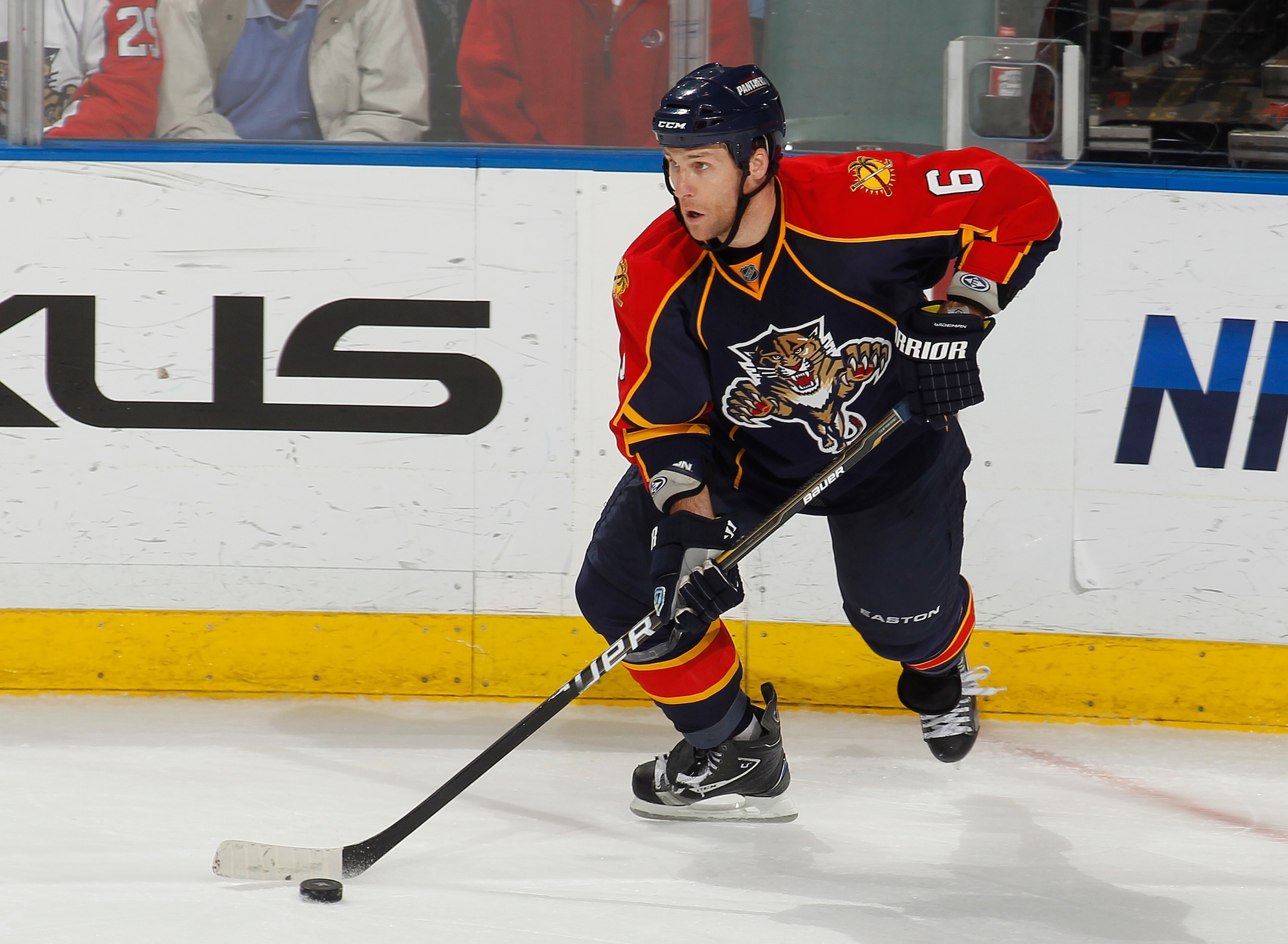 SUNRISE, FL - FEBRUARY 8: Dennis Wideman #6 of the Florida Panthers carries the puck along the boards against the St. Louis Blues on February 8, 2011 at the BankAtlantic Center in Sunrise, Florida. The Blues defeated the Panthers 2-1. (Photo by Joel Auerb