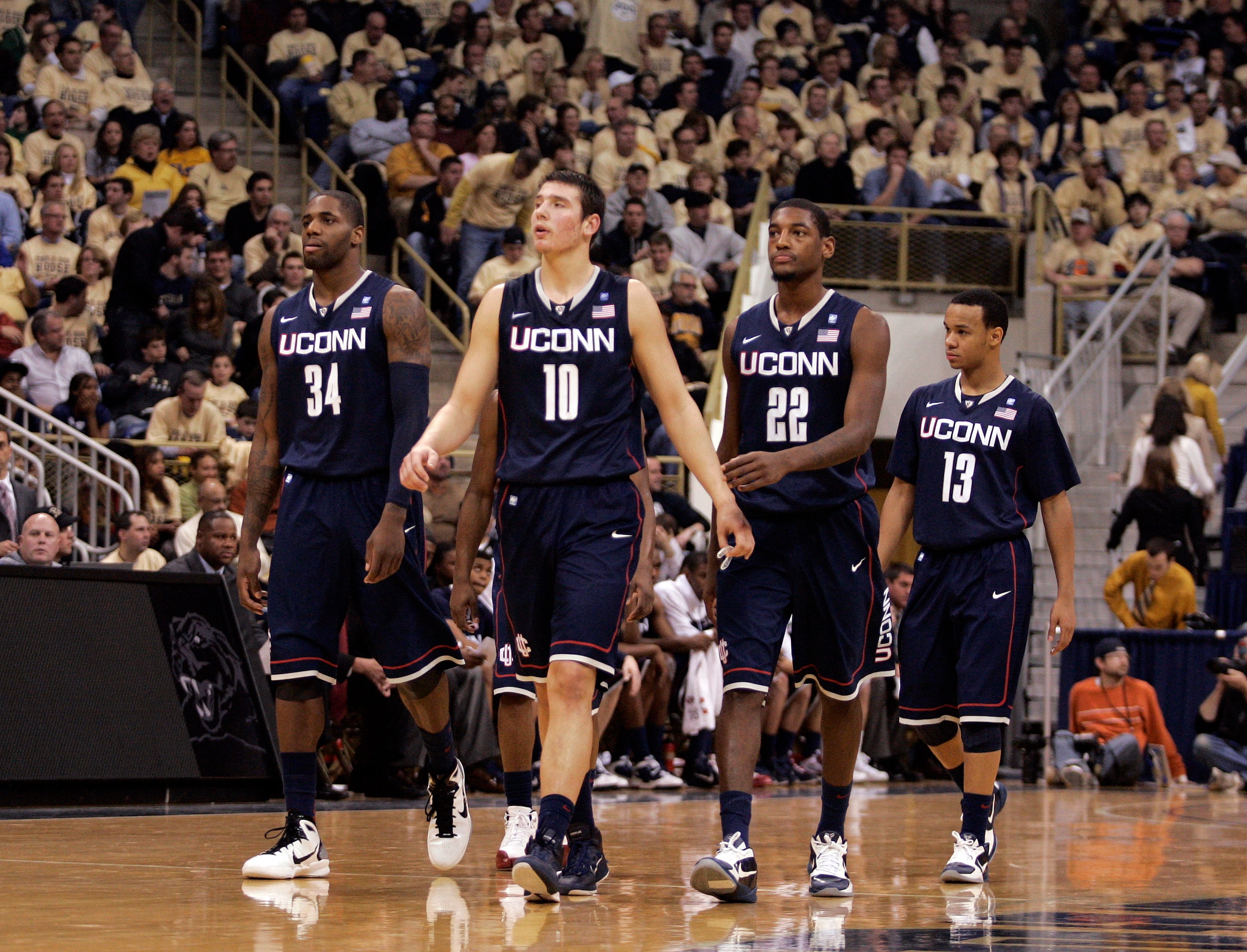 PITTSBURGH, PA - DECEMBER 27: Alex Oriakhi #34, Tyler Olander #10, Roscoe Smith #22 and Shabazz Napier #13 of the Connecticut Huskies walk onto the court after a timeout against the Pittsburgh Panthers at Petersen Events Center on December 27, 2010 in Pi PITTSBURGH, PA - DECEMBER 27: Alex Oriakhi #34, Tyler Olander #10, Roscoe Smith #22 and Shabazz Napier #13 of the Connecticut Huskies walk onto the court after a timeout against the Pittsburgh Panthers at Petersen Events Center on December 27, 2010 in Pi