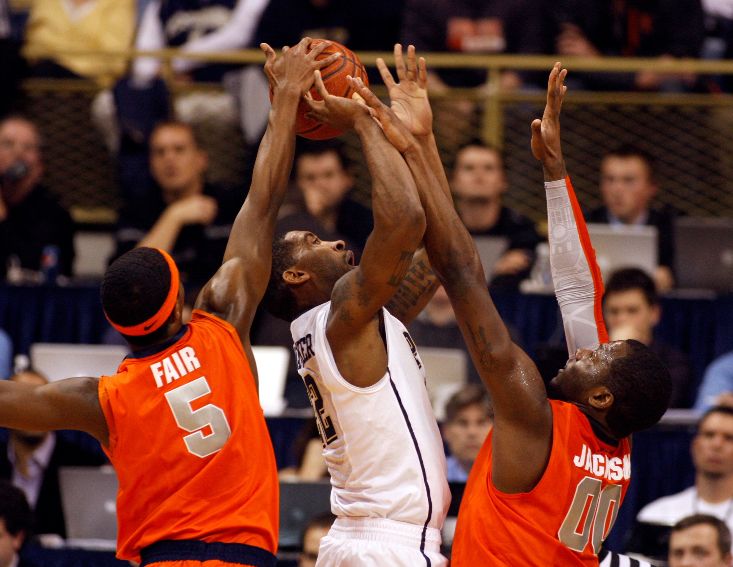 PITTSBURGH, PA - JANUARY 17: Brad Wanamaker #22 of the Pittsburgh Panthers battles to the basket against C.J. Fair #5 and Rick Jackson #0 of the Syracuse Orange at Petersen Events Center on January 17, 2011 in Pittsburgh, Pennsylvania. The Panthers defe PITTSBURGH, PA - JANUARY 17: Brad Wanamaker #22 of the Pittsburgh Panthers battles to the basket against C.J. Fair #5 and Rick Jackson #0 of the Syracuse Orange at Petersen Events Center on January 17, 2011 in Pittsburgh, Pennsylvania. The Panthers defe