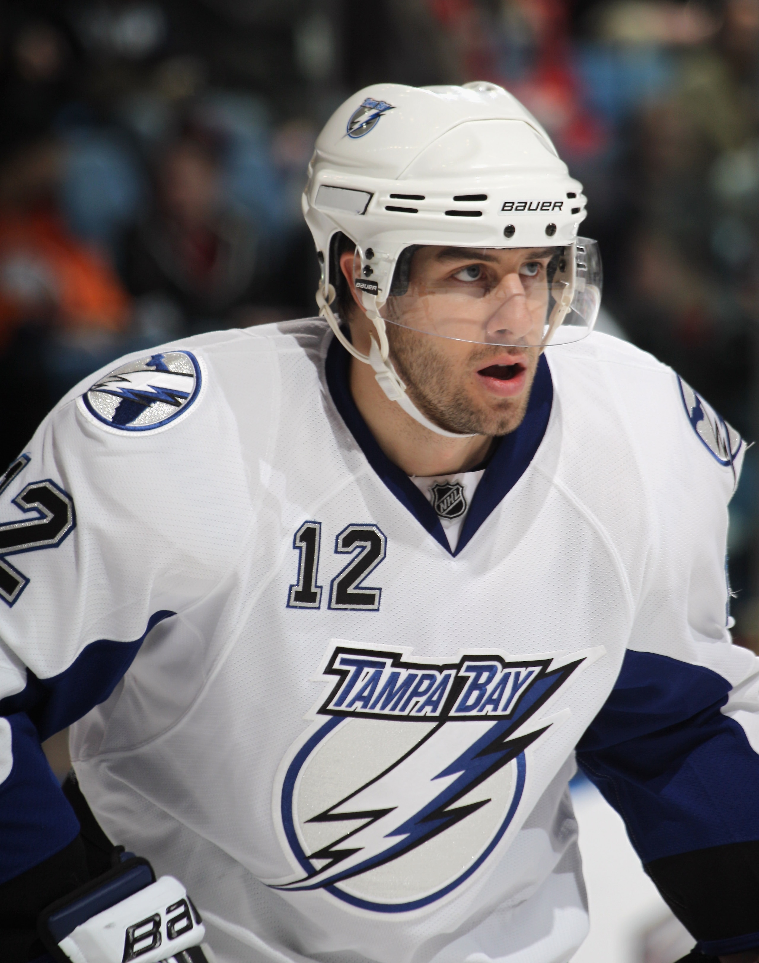 UNIONDALE, NY - DECEMBER 22:  Simon Gagne #12 of the Tampa Bay Lightning skates against the New York Islanders at the Nassau Coliseum on December 22, 2010 in Uniondale, New York.  (Photo by Bruce Bennett/Getty Images)