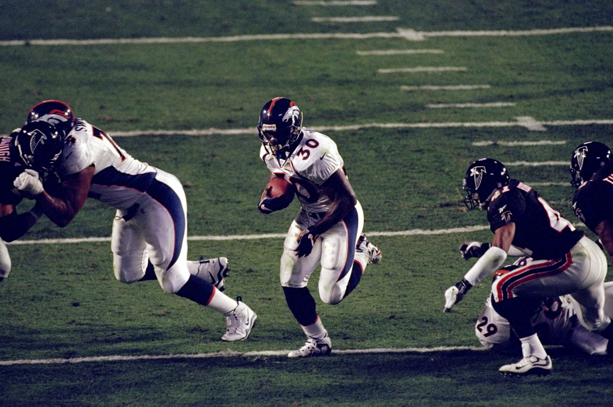 31 Jan 1999:  Terrell Davis #30 of the Denver Broncos in action during the Super Bowl XXXIII Game against the Atlanta Falcons at the Pro Player Stadium in Miami, Florida. The Broncos defeated the Falcons 34-19.