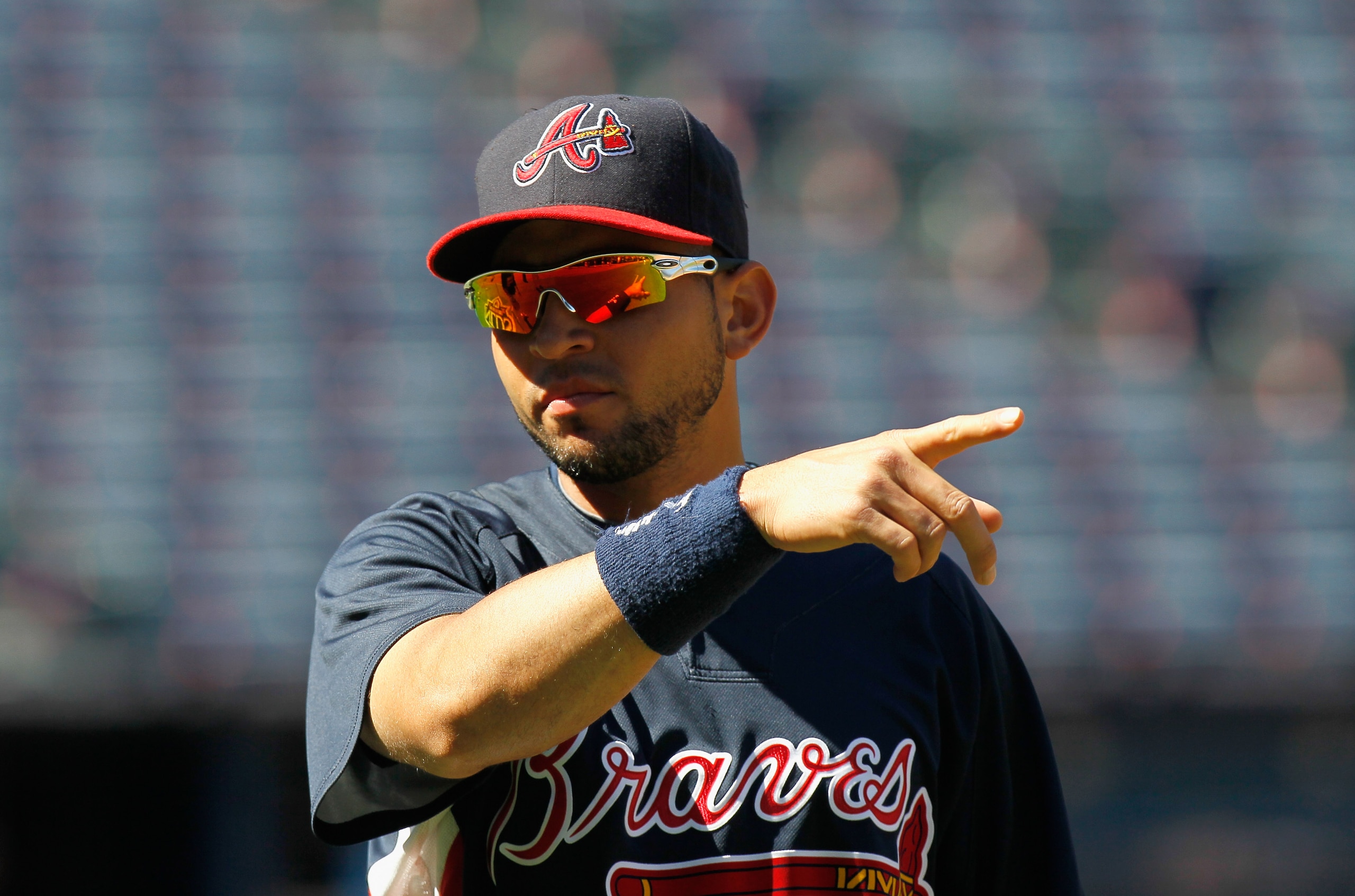 ATLANTA - OCTOBER 10:  Omar Infante #4 of the Atlanta Braves against the San Francisco Giants during Game Three of the NLDS of the 2010 MLB Playoffs at Turner Field on October 10, 2010 in Atlanta, Georgia.  (Photo by Kevin C. Cox/Getty Images)