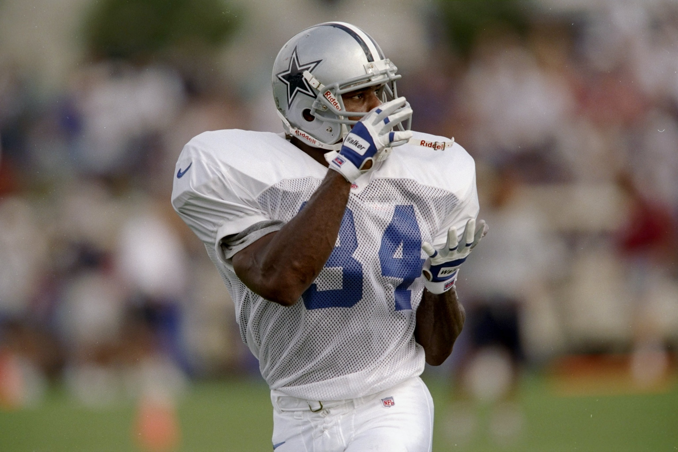 20 Jul 1997:  Running back Herschel Walker #34 of the Dallas Cowboys in action during the Cowboys training camp in Austin, Texas. Mandatory Credit: Stephen Dunn  /Allsport