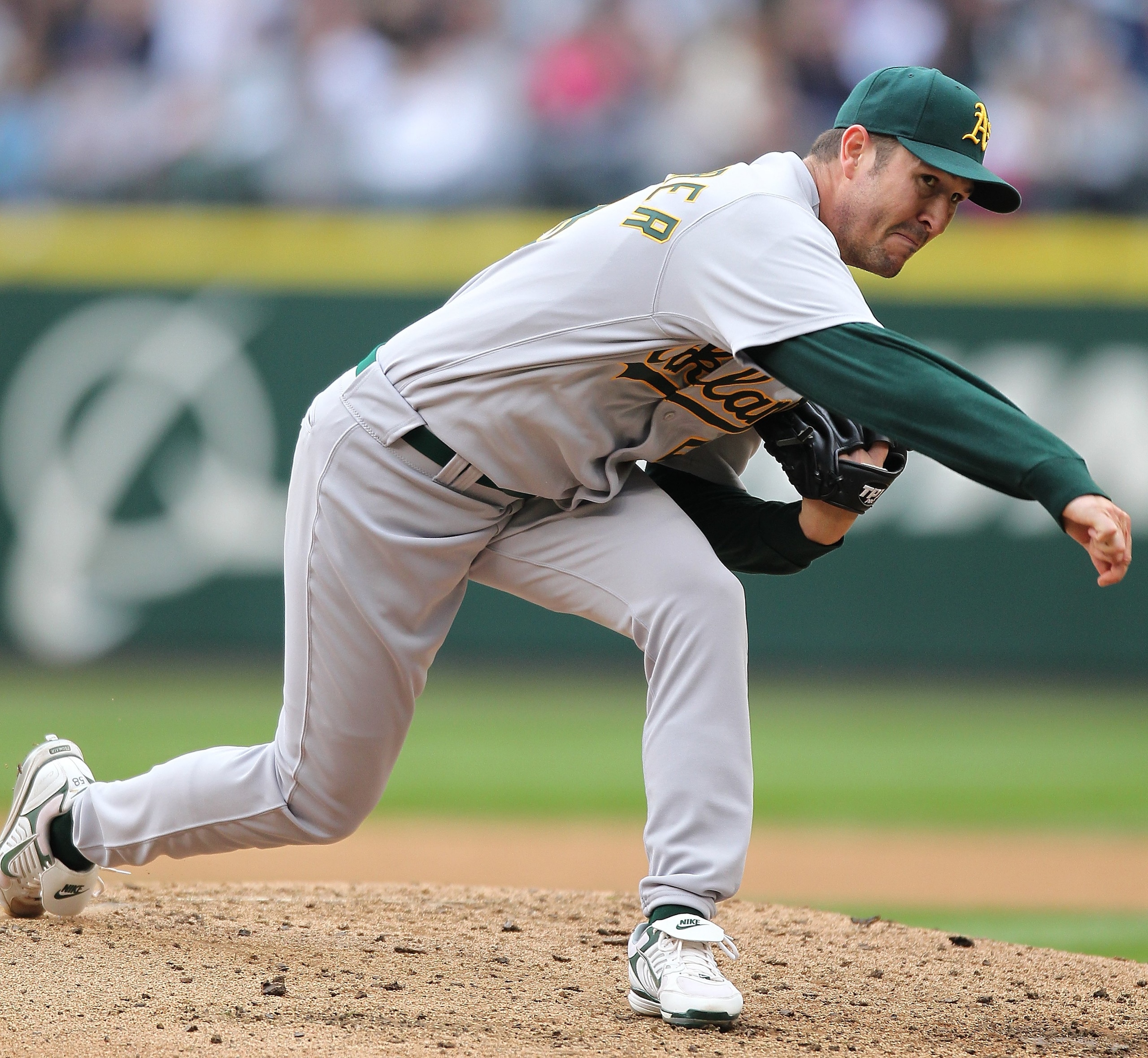 SEATTLE - APRIL 12:  Starting pitcher Justin Duchscherer #58 of the the Oakland Athletics pitches against the Seattle Mariners during the Mariners' home opener at Safeco Field on April 12, 2010 in Seattle, Washington. (Photo by Otto Greule Jr/Getty Images