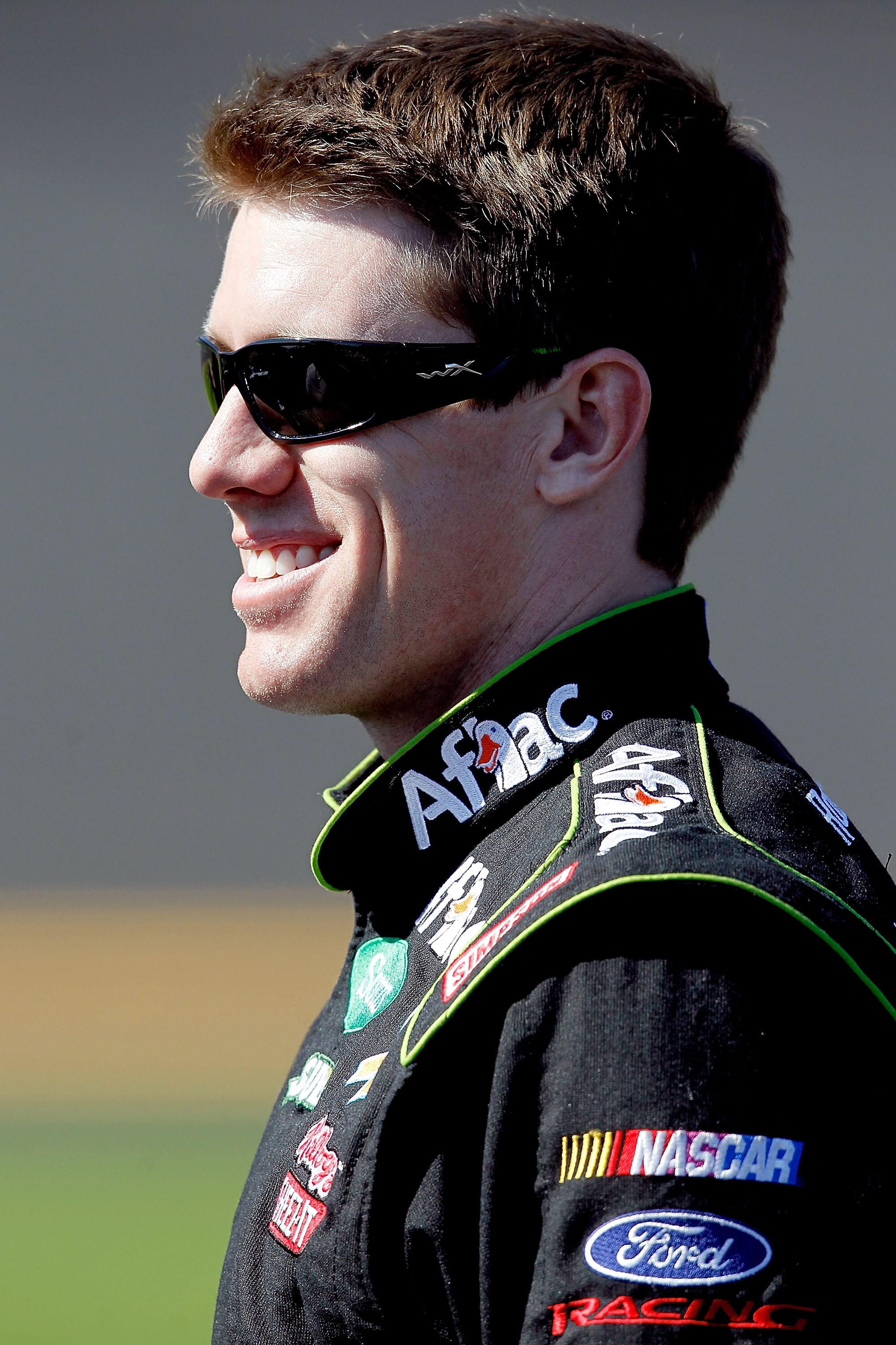 DAYTONA BEACH, FL - FEBRUARY 13: Carl Edwards, driver of the #99 Aflac Ford, walks on the grid during qualifying for the NASCAR Sprint Cup Series Daytona 500 at Daytona International Speedway on February 13, 2011 in Daytona Beach, Florida.  (Photo by Matt