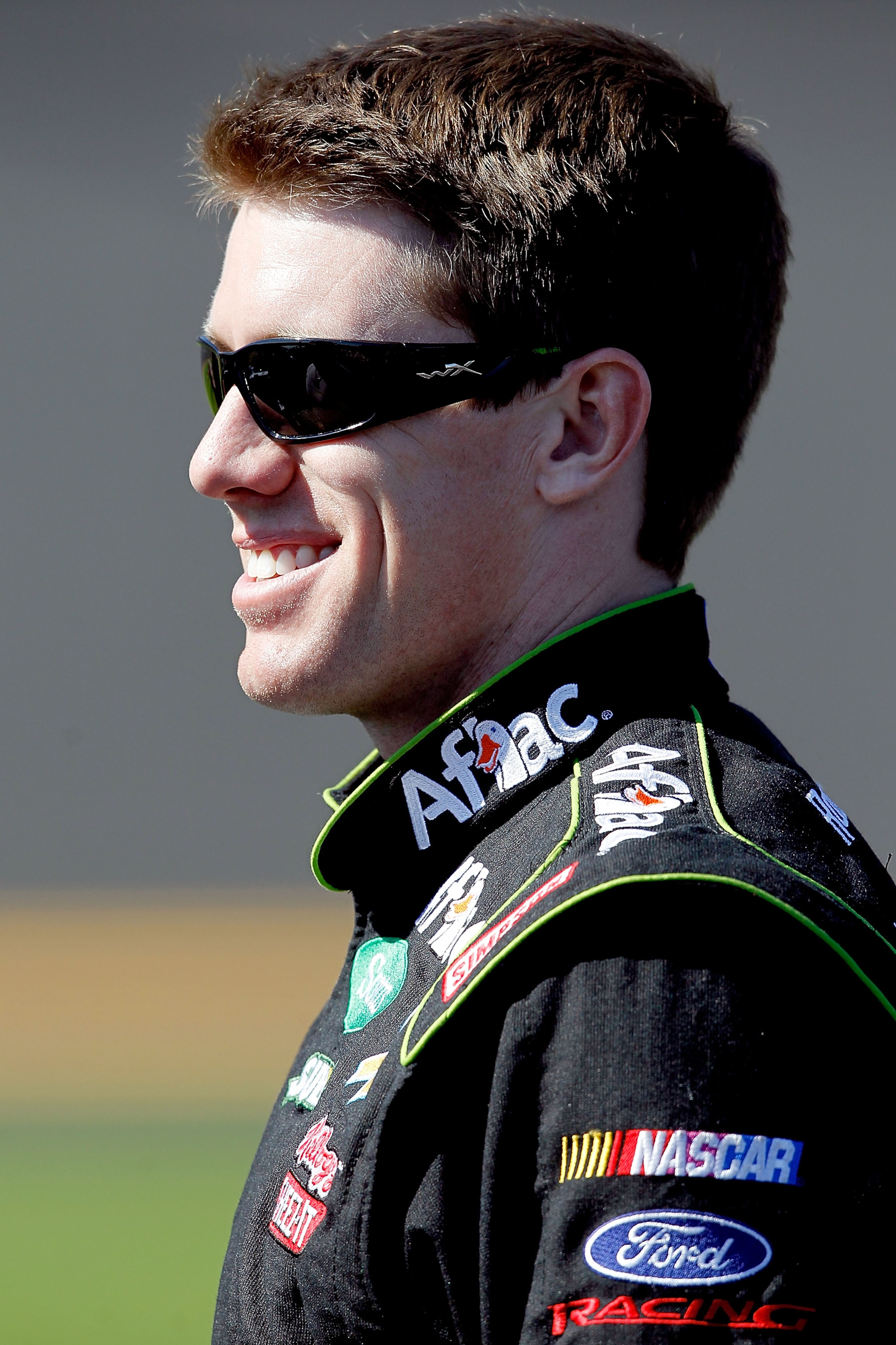 DAYTONA BEACH, FL - FEBRUARY 13: Carl Edwards, driver of the #99 Aflac Ford, walks on the grid during qualifying for the NASCAR Sprint Cup Series Daytona 500 at Daytona International Speedway on February 13, 2011 in Daytona Beach, Florida.  (Photo by Matt