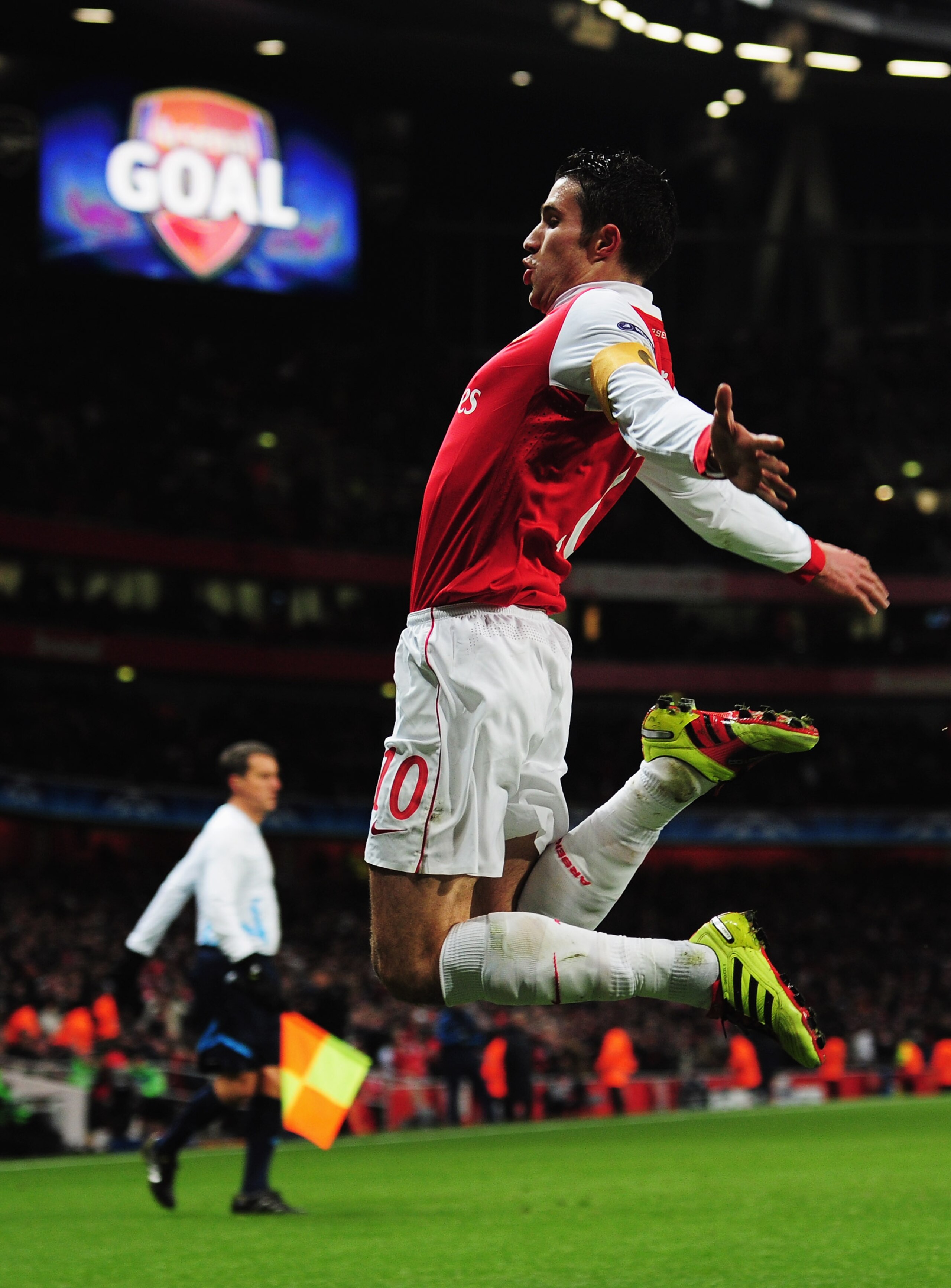 LONDON, ENGLAND - DECEMBER 08:  Robin van Persie of Arsenal celebrates as he scores their first goal from the penalty spot during the UEFA Champions League Group H match between Arsenal and FK Partizan Belgrade at the Emirates Stadium on December 8, 2010