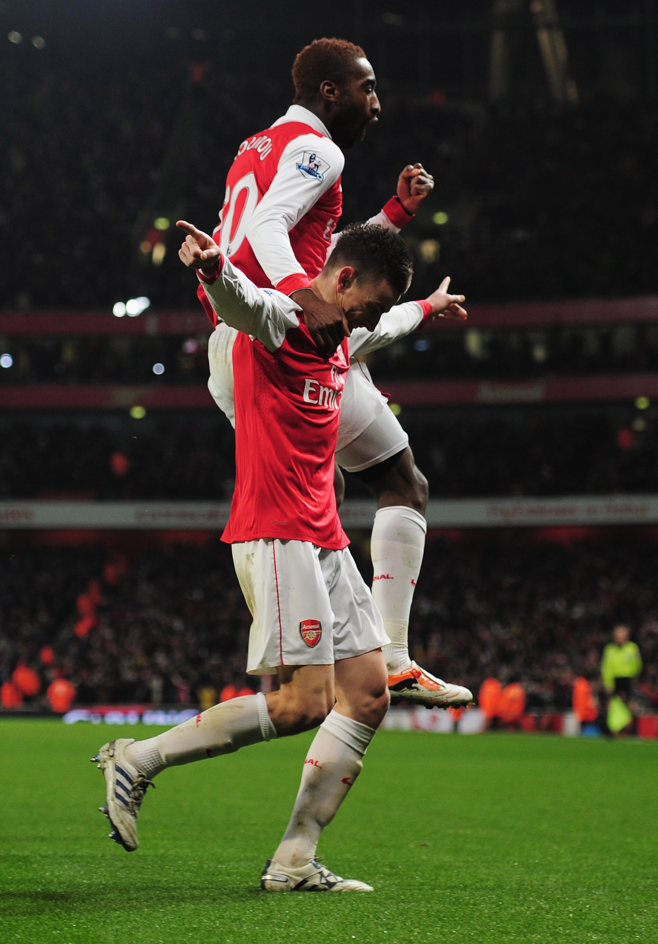 LONDON, ENGLAND - JANUARY 25:  Laurent Koscielny of Arsenal celebrates with Johan Djourou as he scores their second goal during the Carling Cup Semi Final Second Leg match between Arsenal and Ipswich Town at Emirates Stadium on January 25, 2011 in London,