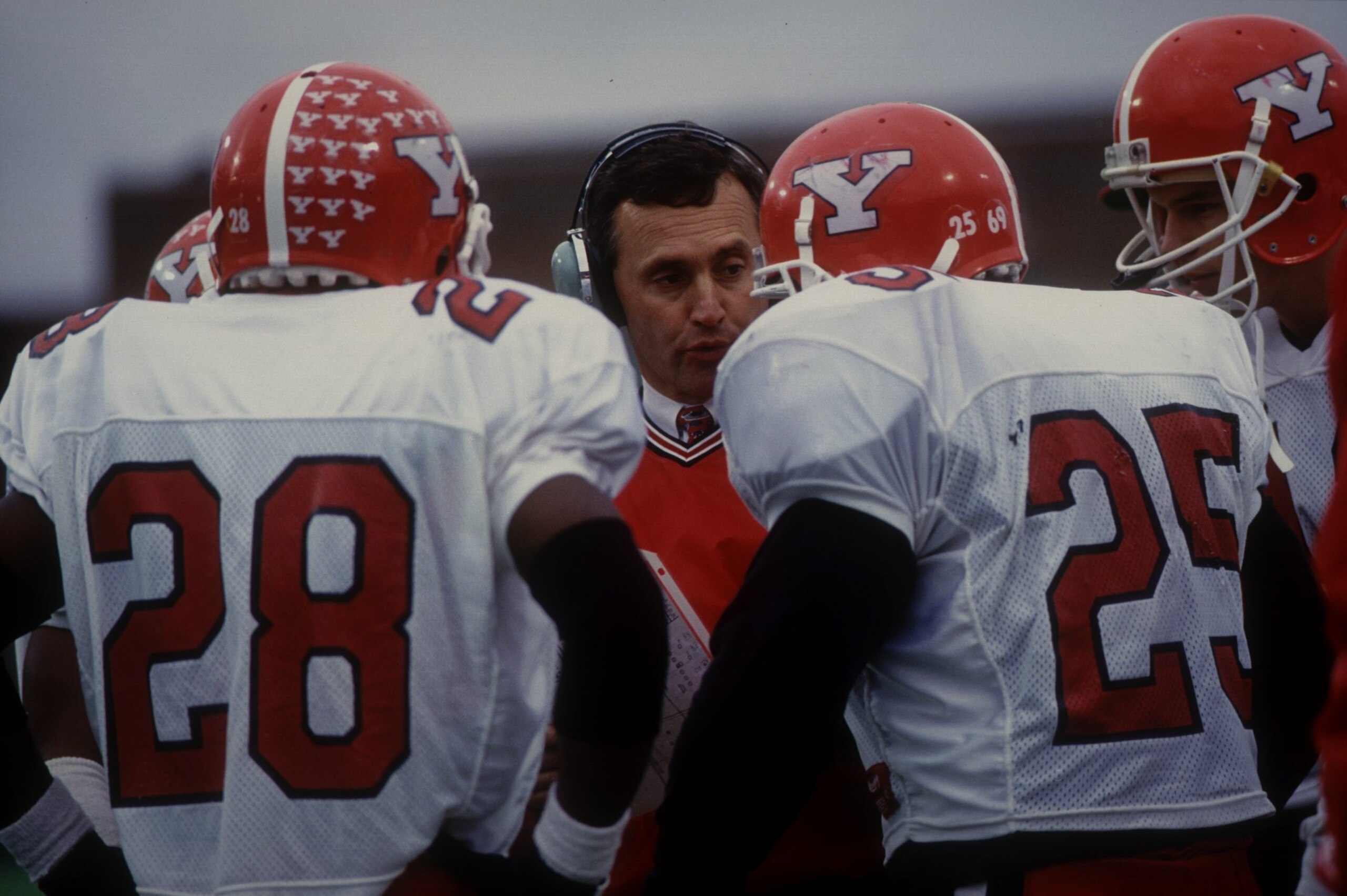 18 DECEMBER 1993: THE COACH OF THE PENGUINS TALKS TO CHARLES PERDUE ( 28 ) AND TAMRON SMITH ( 25 ) WHEN YOUNGSTOWN STATE PENGUINS 17 DEFEATED MARSHALL THUNDERING HERD 5 AT MARSHALL UNIVERSITY STADIUM