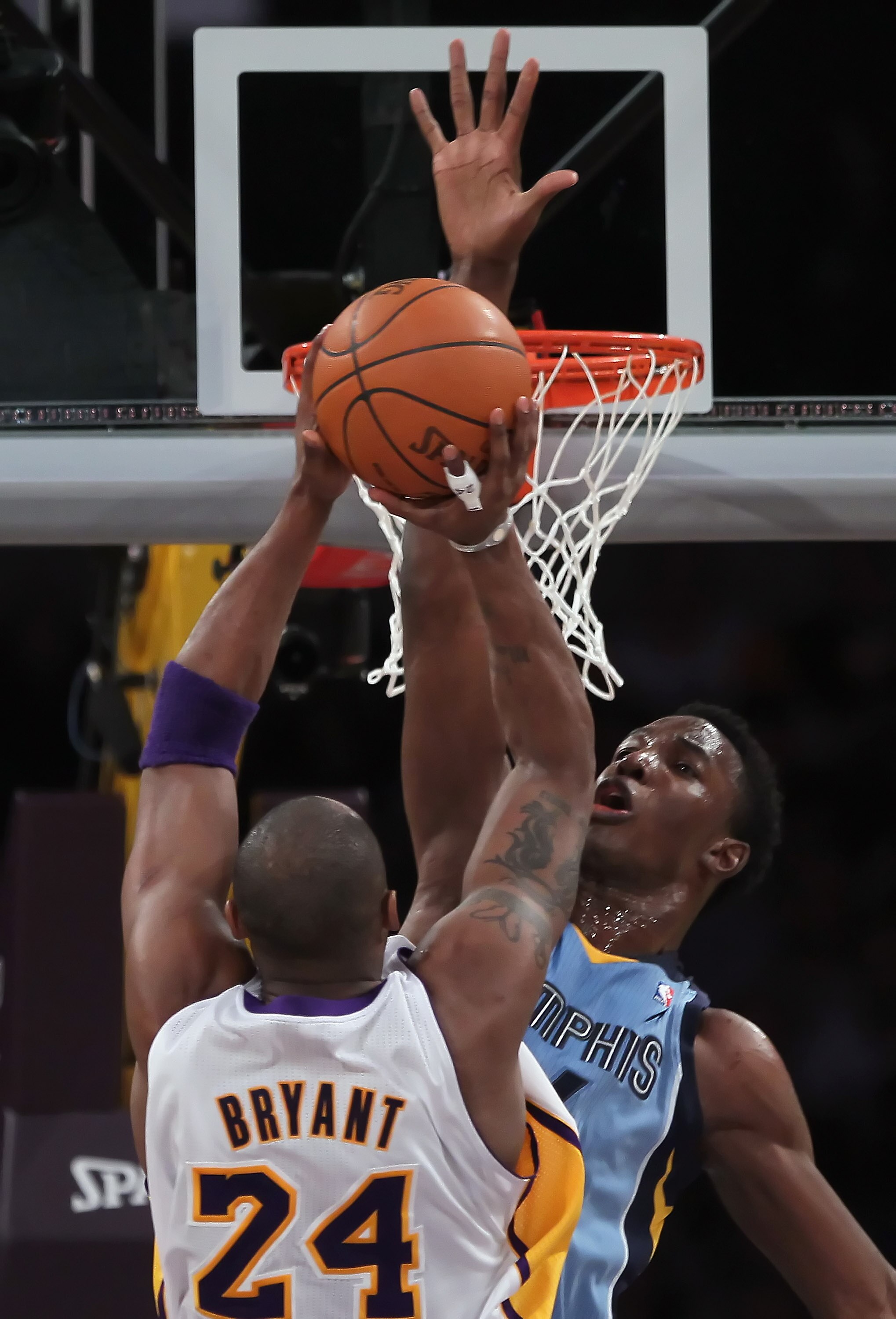 LOS ANGELES, CA - JANUARY 02:  Hasheem Thabeet #34 of the Memphis Grizzlies goes up to block a shot by Kobe Bryant #24 of the Los Angeles Lakers during the first half at Staples Center on January 2, 2011 in Los Angeles, California. The Grizzlies defeated