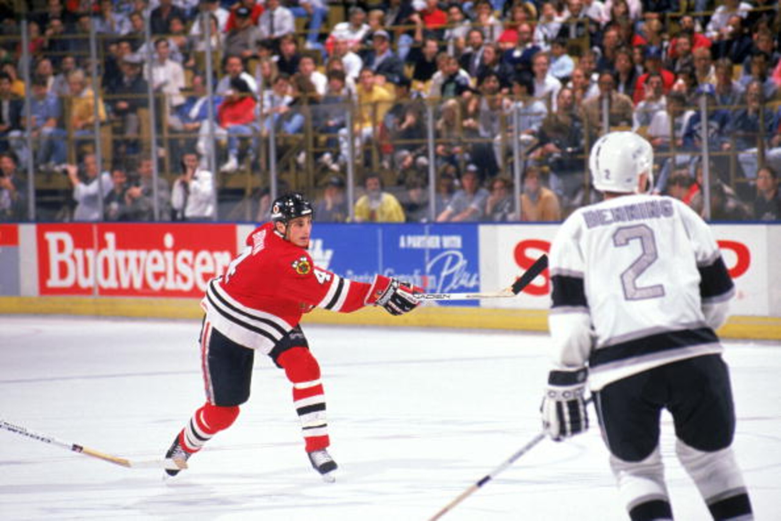 INGLEWOOD, CA - 1989:  Defense Keith Brown #4 of the Chicago Blackhawks takes a shot against the Los Angeles Kings during a game at the Great Western Forum during the 1989-90 season in Inglewood, California.  (Photo by Mike Powell/Getty Images)