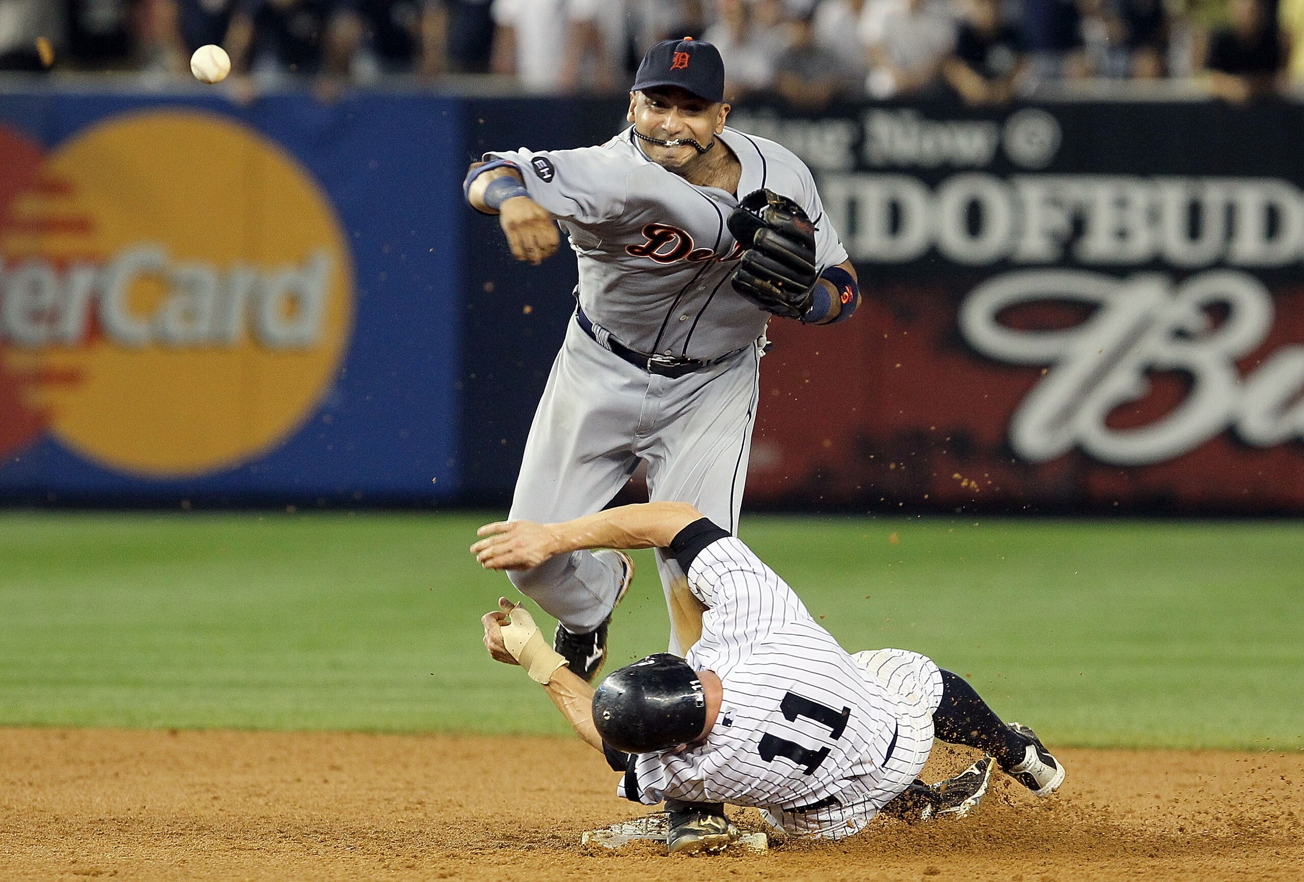 NEW YORK - AUGUST 16:  Carlos Guillen #9 of the Detroit Tigers completes a game ending double play after forcing out Brett Gardner #11 of the New York Yankees on August 16, 2010 at Yankee Stadium in the Bronx borough of New York City. The Tigers defeated