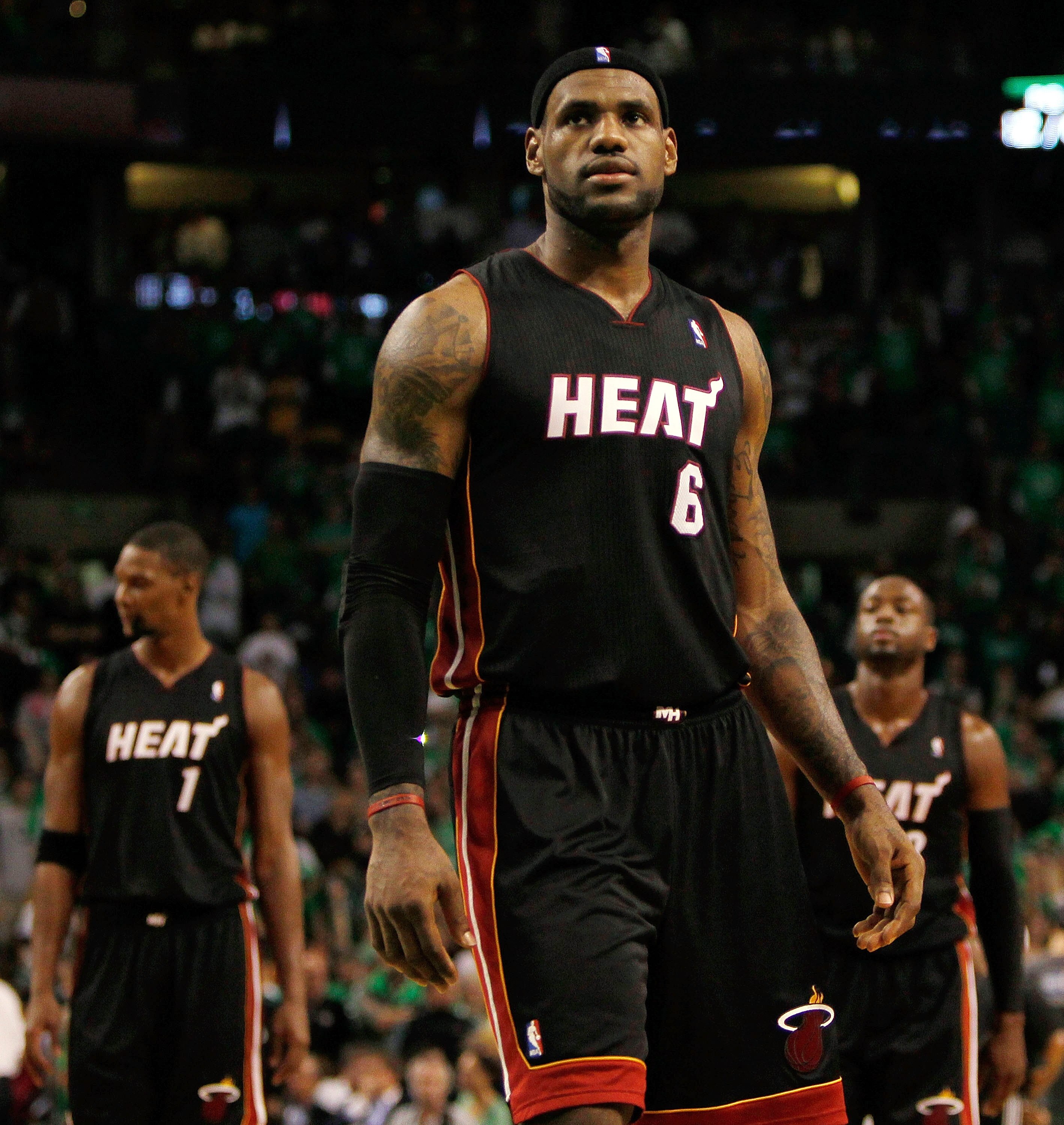 BOSTON, MA - OCTOBER 26: LeBron James #6, Chris Bosh #1 and Dwyane Wade #3 of the Miami Heat walk into position moments before losing to the Boston Celtics, 88-80, at the TD Banknorth Garden on October 26, 2010 in Boston, Massachusetts. NOTE TO USER: User