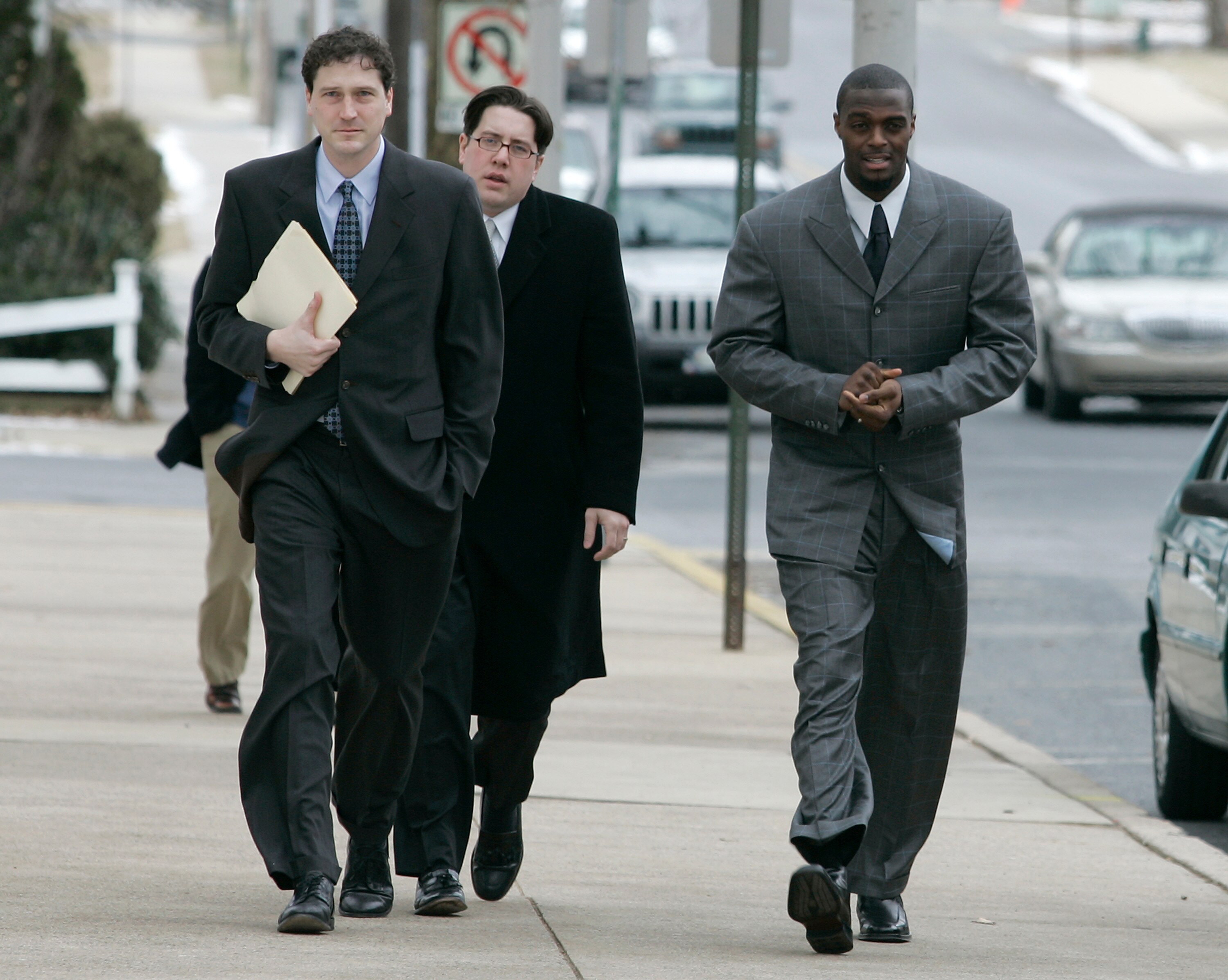 LEBANON - JANUARY 14: New York Giants wide receiver Plaxico Burress, right, walks with members of legal team as he arrives at the Lebanon County Courthouse January 14, 2009 in Lebanon, Pa.  Burress is scheduled to appear in a civil trial in a dispute with