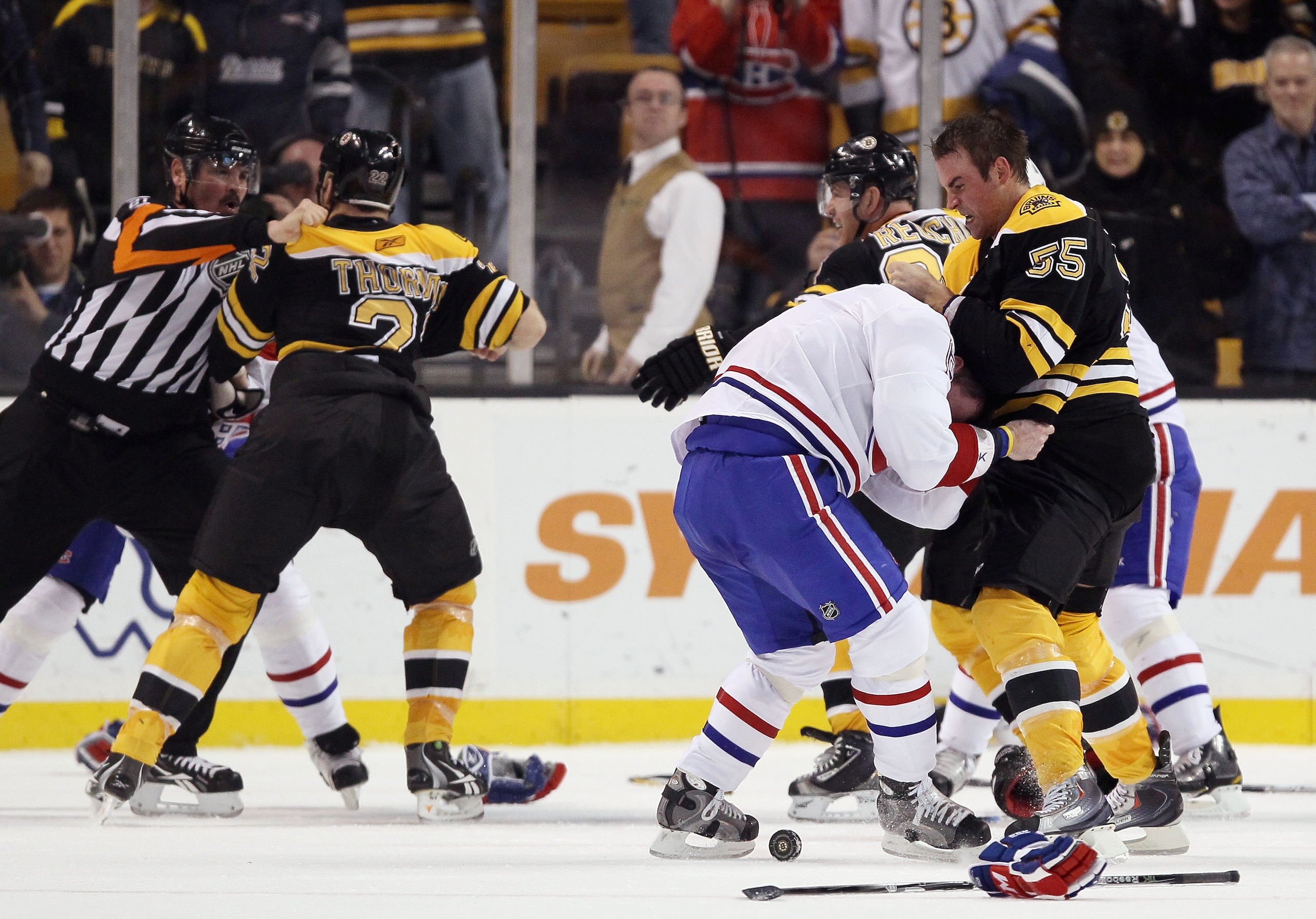 BOSTON, MA - FEBRUARY 09:  Johnny Boychuk #55 of the Boston Bruins fights with Jaroslav Spacek #6 of the Montreal Canadiens is Shawn Thornton #22 of the Bruins and Brian Gionta #21 of the Canadiens fight on February 9, 2011 at the TD Garden in Boston, Mas