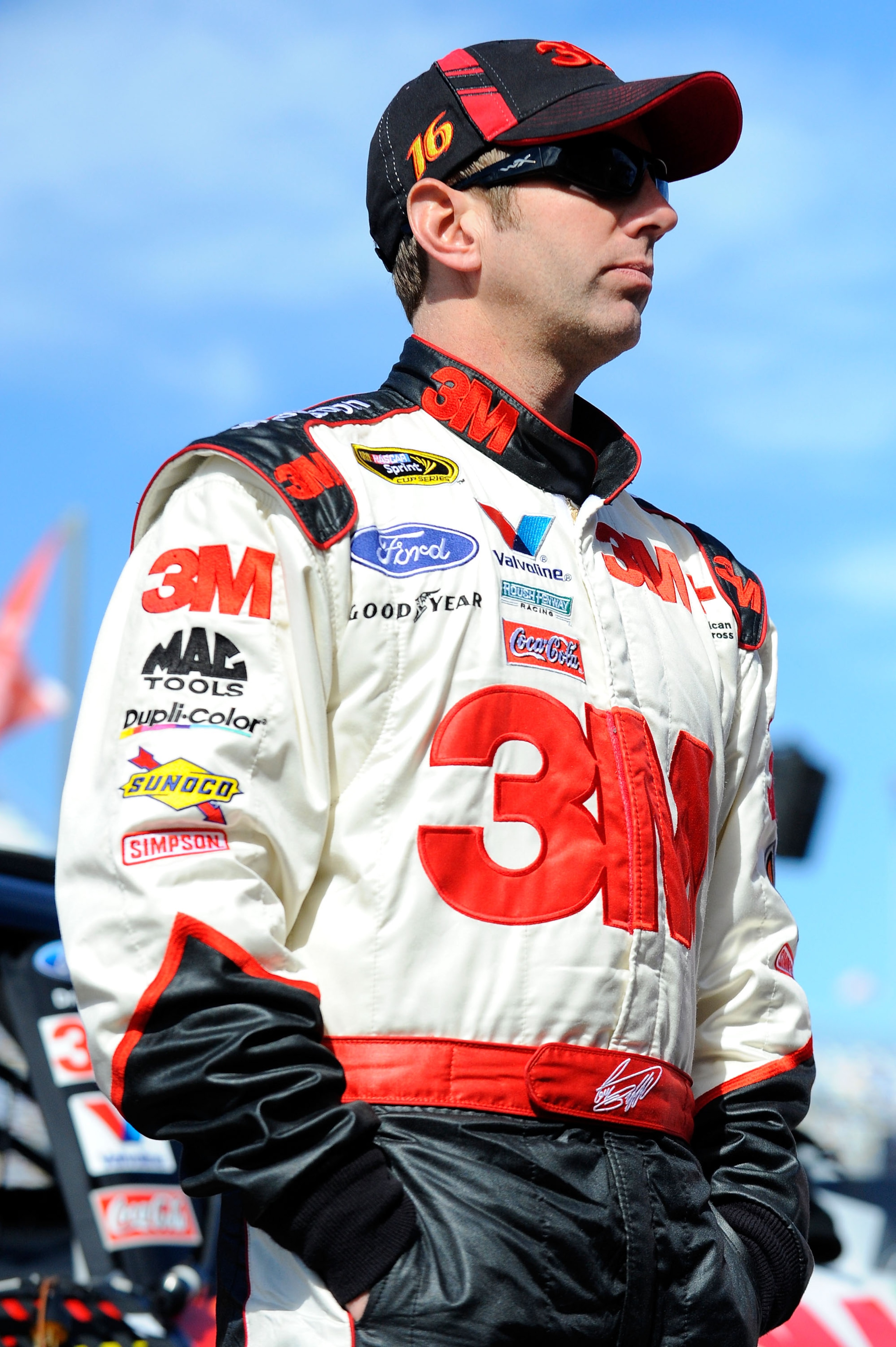 DAYTONA BEACH, FL - FEBRUARY 12:  Greg Biffle, driver of the #16 3M Ford, stands in the garage area during practice for the NASCAR Sprint Cup Series Daytona 500 at Daytona International Speedway on February 12, 2011 in Daytona Beach, Florida.  (Photo by J
