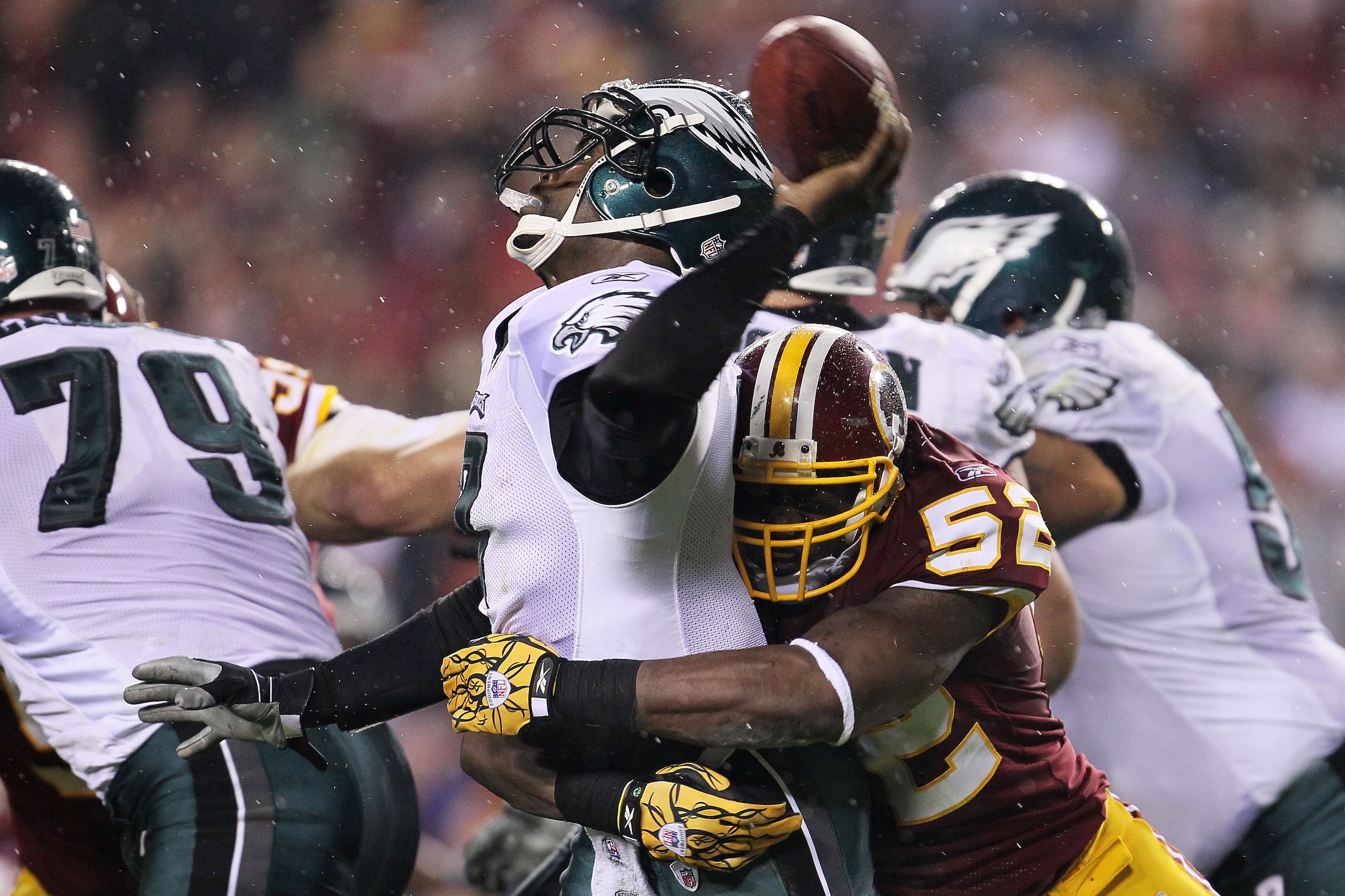 LANDOVER, MD - NOVEMBER 15:  Michael Vick #7 of the Philadelphia Eagles is sacked by Rocky McIntosh #52 of the Washington Redskins on November 15, 2010 at FedExField in Landover, Maryland.  (Photo by Chris McGrath/Getty Images)
