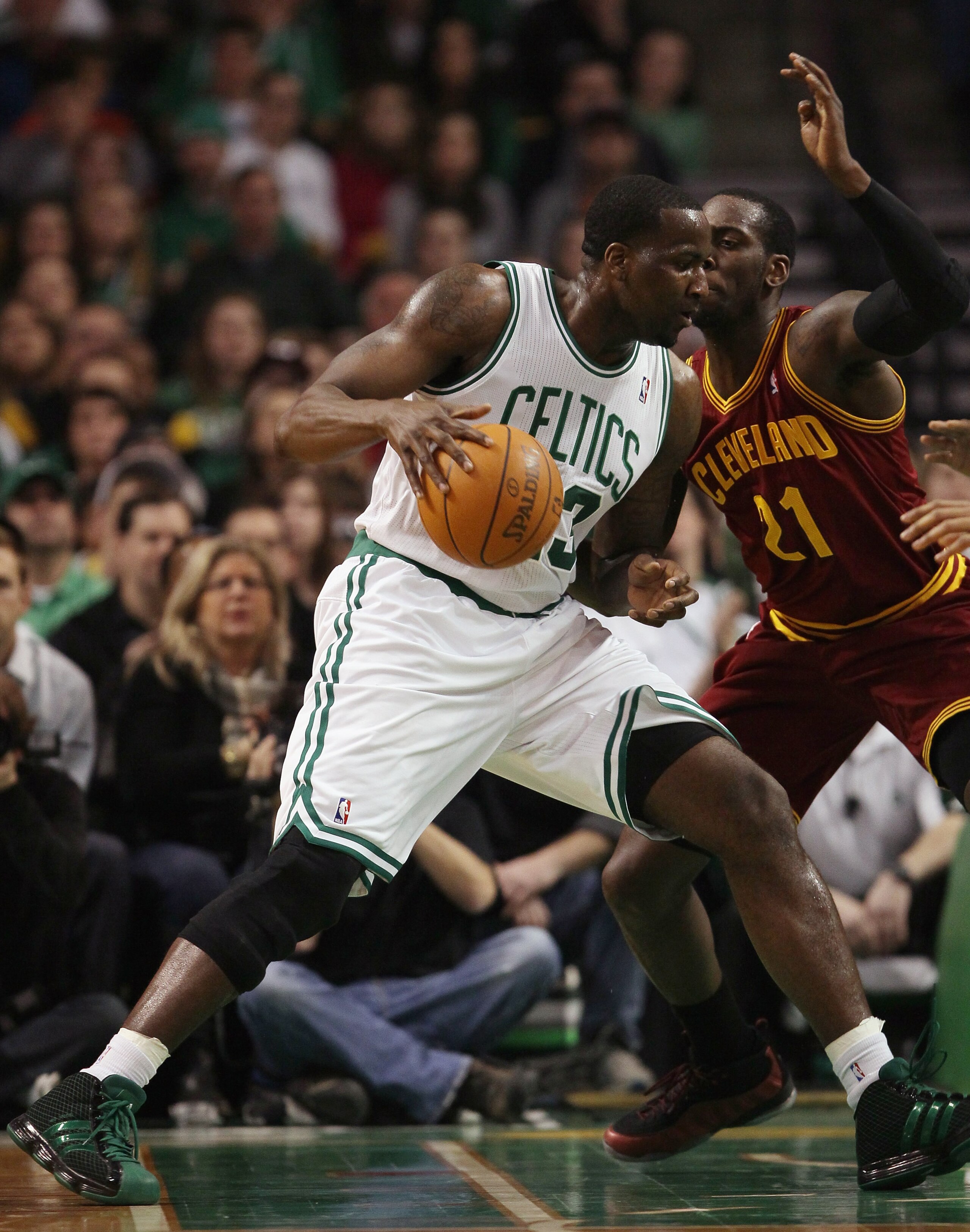 BOSTON, MA - JANUARY 25:  Kendrick Perkins #43 of the Boston Celtics heads for the net as J.J. Hickson #21 of the of the Cleveland Cavaliers defends on January 25, 2011 at the TD Garden in Boston, Massachusetts.   NOTE TO USER: User expressly acknowledges