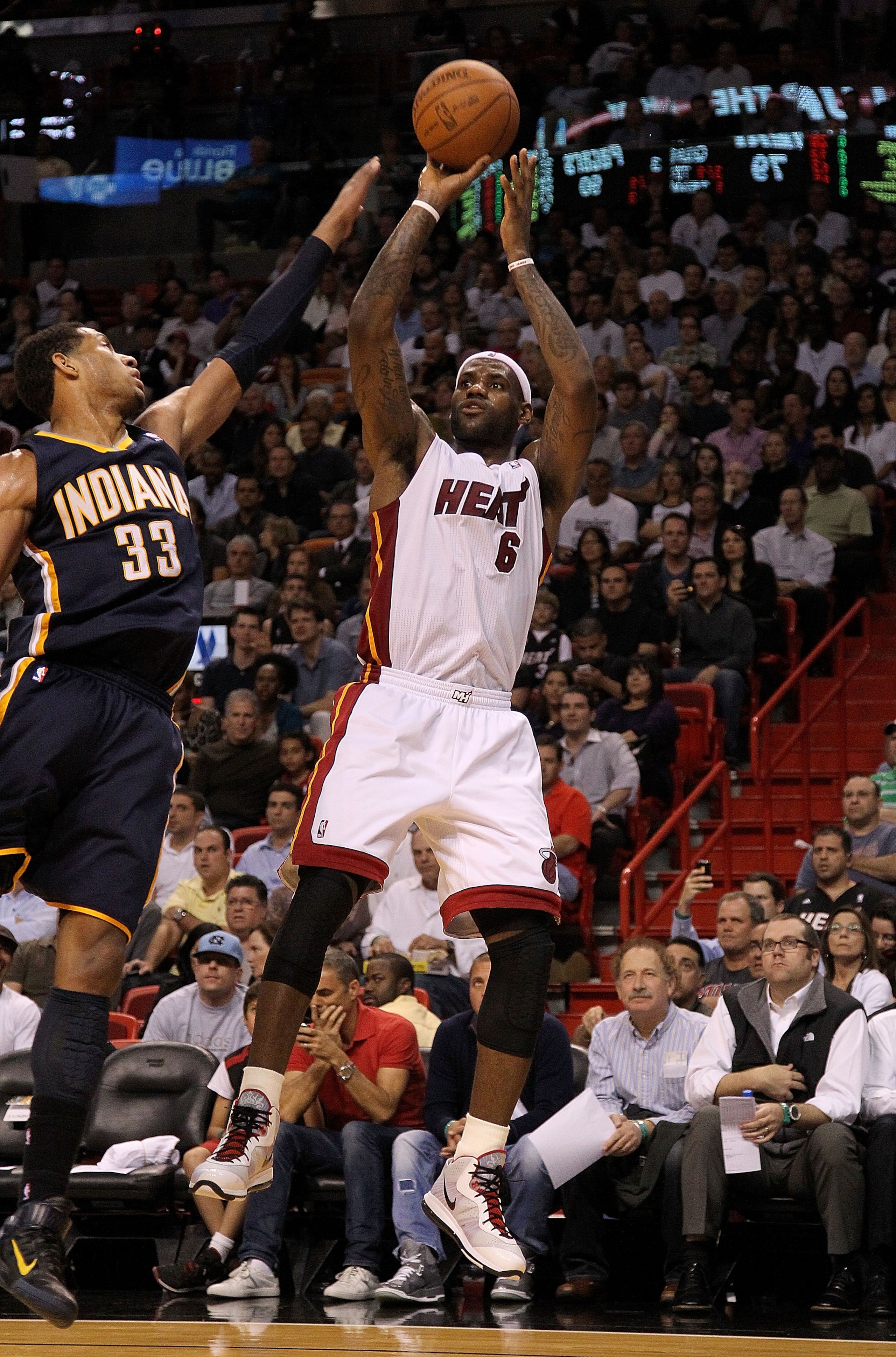 MIAMI, FL - FEBRUARY 08:  LeBron James #6 of the Miami Heat shoots over Danny Granger #33 of the Indiana Pacers during a game at American Airlines Arena on February 8, 2011 in Miami, Florida. NOTE TO USER: User expressly acknowledges and agrees that, by d