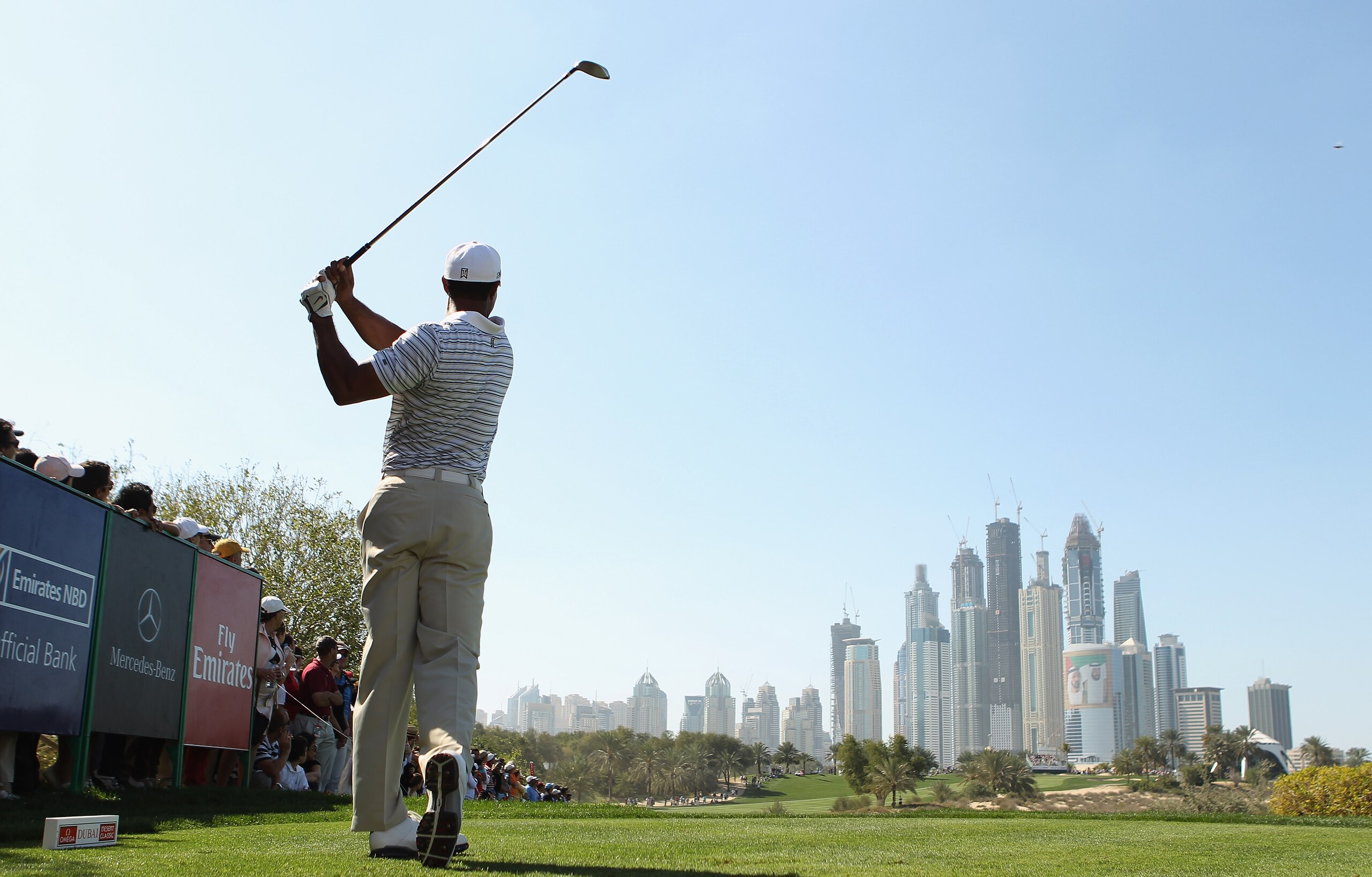 DUBAI, UNITED ARAB EMIRATES - FEBRUARY 12:  Tiger Woods of the USA in action during the third round for the 2011 Omega Dubai desert Classic held on the Majilis Course at the Emirates Golf Club on February 12, 2011 in Dubai, United Arab Emirates.  (Photo b