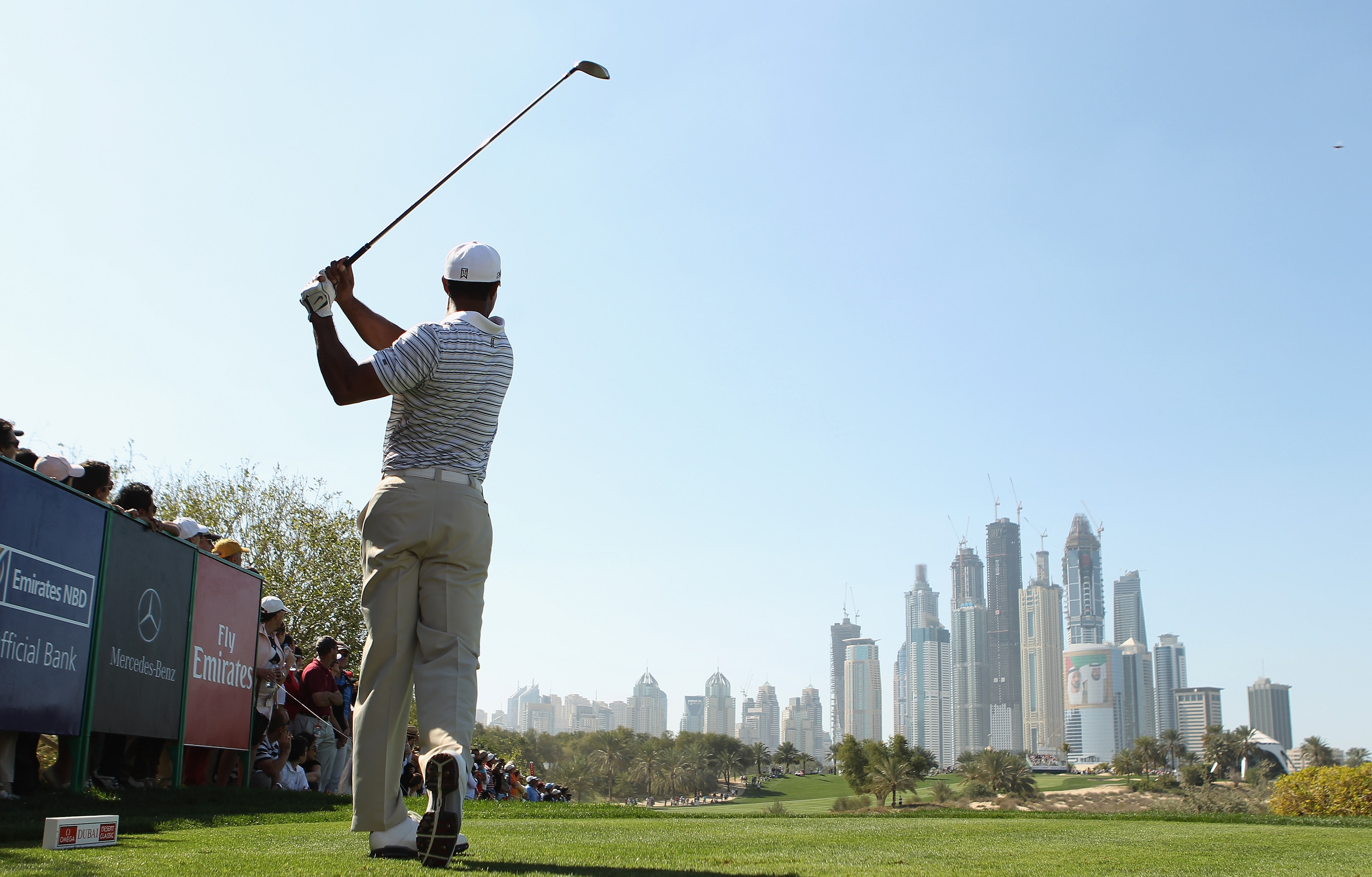 DUBAI, UNITED ARAB EMIRATES - FEBRUARY 12:  Tiger Woods of the USA in action during the third round for the 2011 Omega Dubai desert Classic held on the Majilis Course at the Emirates Golf Club on February 12, 2011 in Dubai, United Arab Emirates.  (Photo b