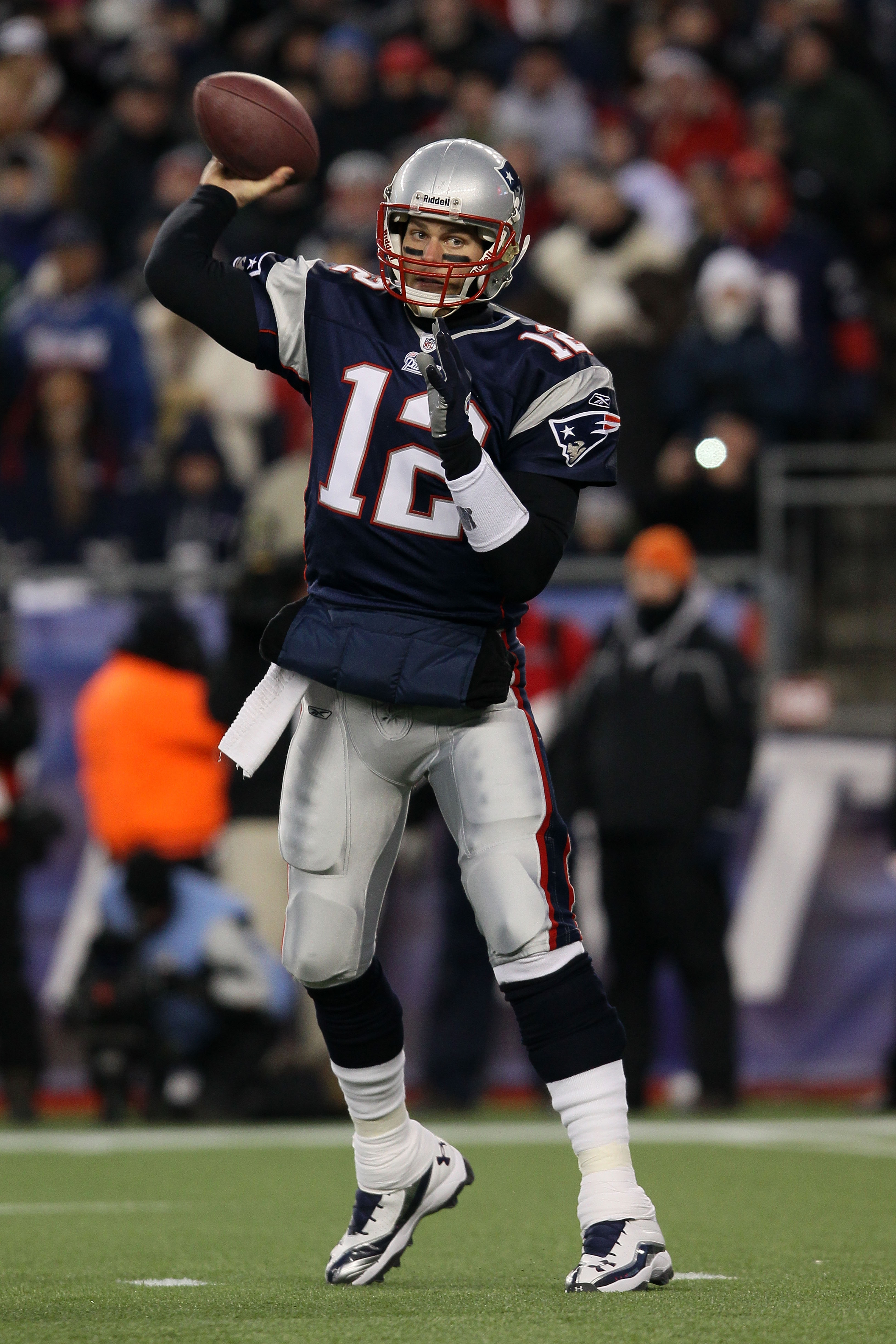 FOXBORO, MA - JANUARY 16:  Quarterback Tom Brady #12 of the New England Patriots throws a pass during their 2011 AFC divisional playoff game against the New York Jets at Gillette Stadium on January 16, 2011 in Foxboro, Massachusetts.  (Photo by Elsa/Getty