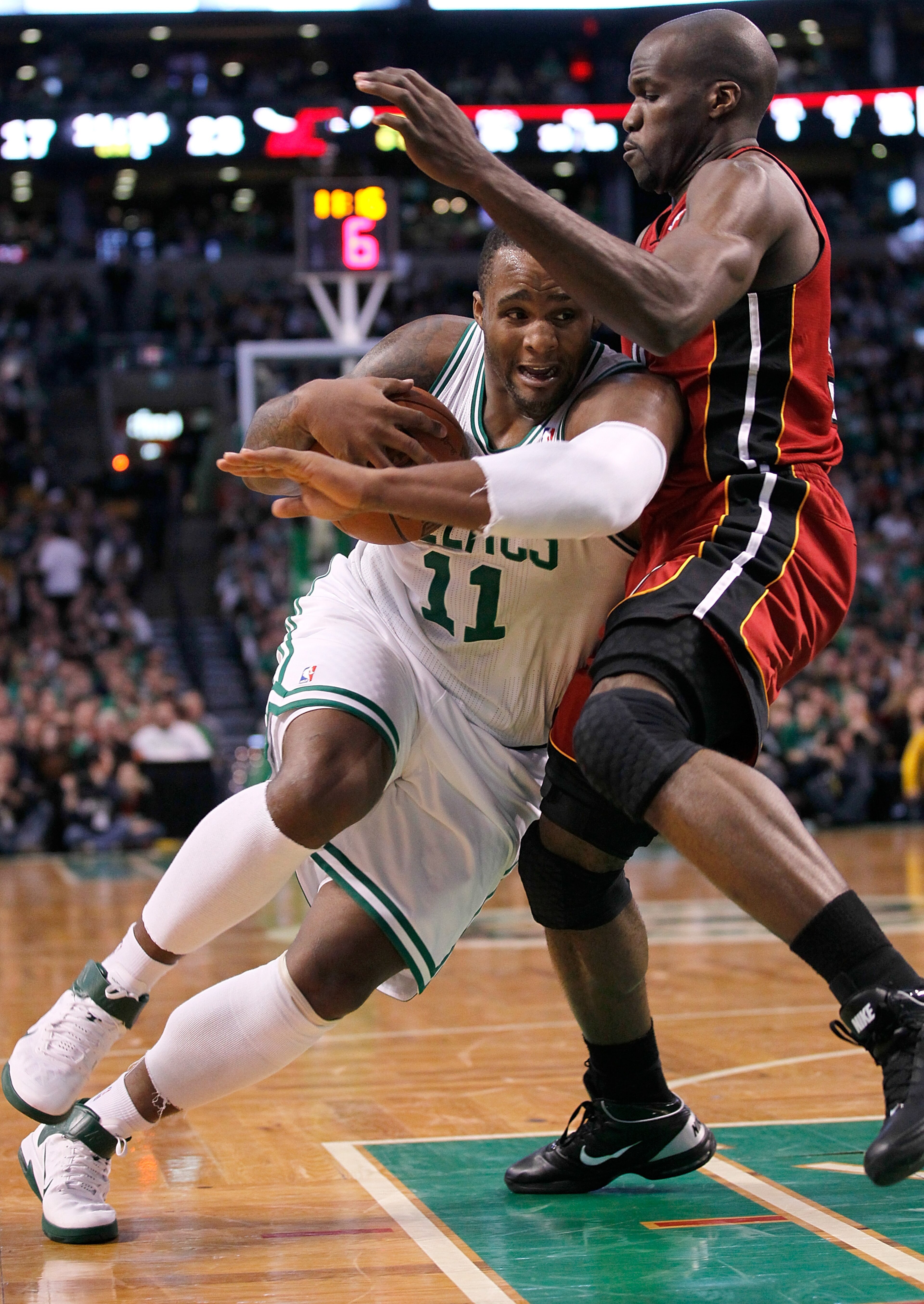 BOSTON - FEBRUARY 13: Glen Davis #11 of the Boston Celtics drives against Joel Anthony #50 of the Miami Heat at TD Garden on February 13, 2011 in Boston, Massachusetts. The Celtics won 85-82. NOTE TO USER: User expressly acknowledges and agrees that, by BOSTON - FEBRUARY 13: Glen Davis #11 of the Boston Celtics drives against Joel Anthony #50 of the Miami Heat at TD Garden on February 13, 2011 in Boston, Massachusetts. The Celtics won 85-82. NOTE TO USER: User expressly acknowledges and agrees that, by