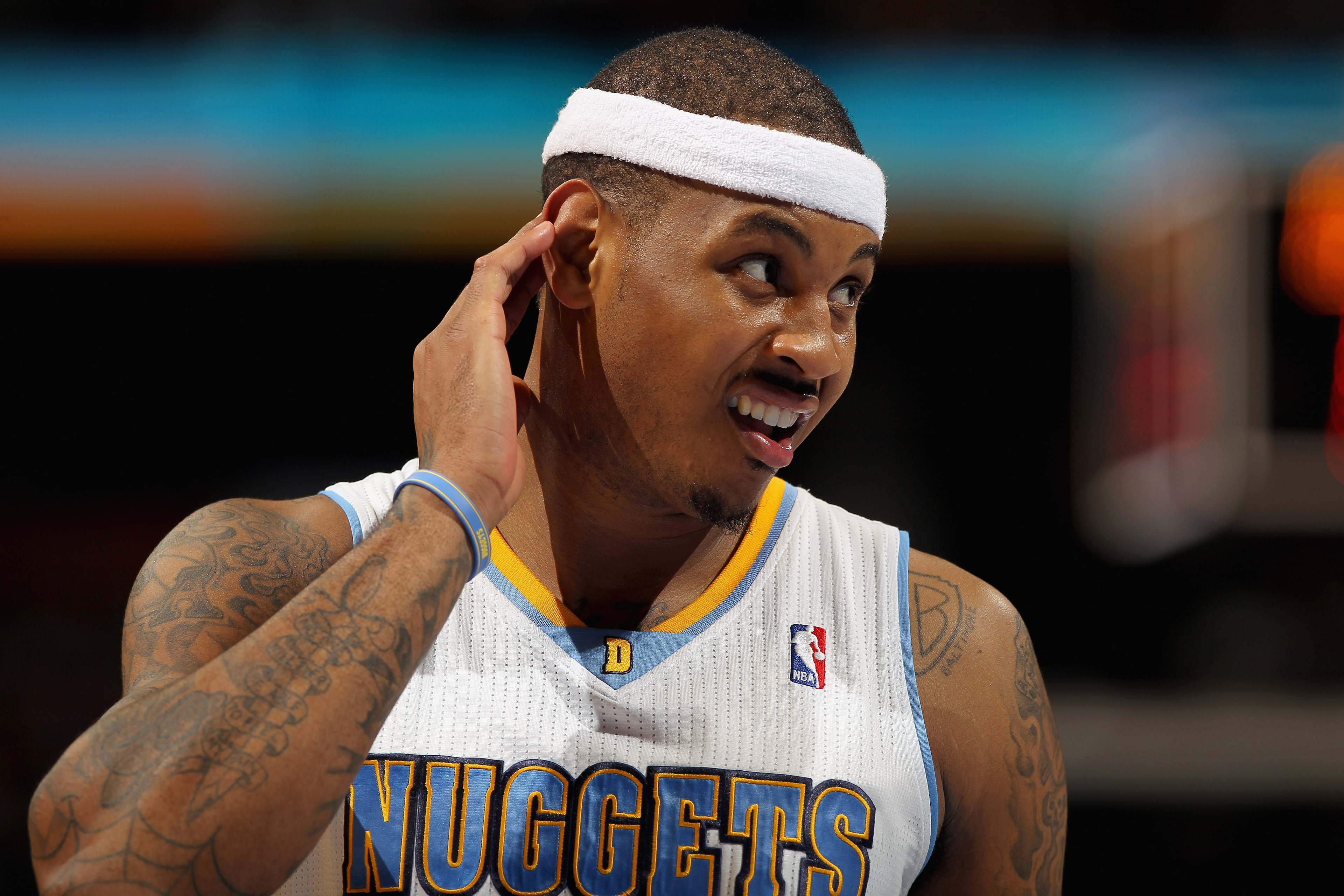 DENVER, CO - FEBRUARY 10: Carmelo Anthony #15 of the Denver Nuggets looks on during a break in the action against the Dallas Mavericks during NBA action at the Pepsi Center on February 10, 2011 in Denver, Colorado. The Nuggets defeated the Mavericks 121- DENVER, CO - FEBRUARY 10: Carmelo Anthony #15 of the Denver Nuggets looks on during a break in the action against the Dallas Mavericks during NBA action at the Pepsi Center on February 10, 2011 in Denver, Colorado. The Nuggets defeated the Mavericks 121-