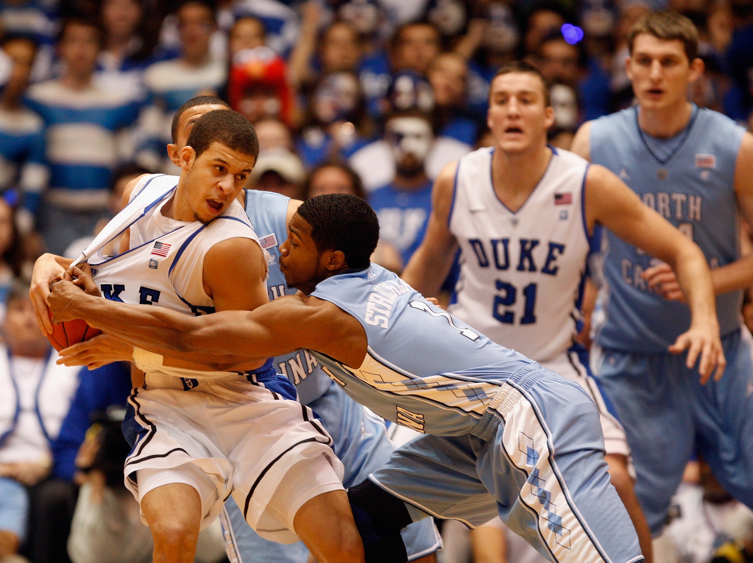 DURHAM, NC - FEBRUARY 09:  Dexter Strickland #1 of the North Carolina Tar Heels tries to steal the ball away from Seth Curry #30 of the Duke Blue Devils during their game at Cameron Indoor Stadium on February 9, 2011 in Durham, North Carolina.  (Photo by