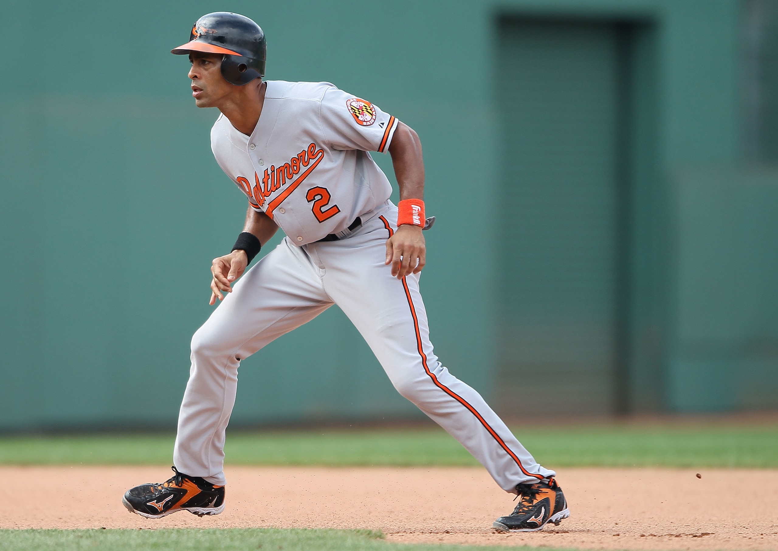 BOSTON - JULY 04:  Julio Lugo #2 of the Baltimore Orioles leads off second base in the game against the Boston Red Sox on July 4, 2010 at Fenway Park in Boston, Massachusetts.  (Photo by Elsa/Getty Images)