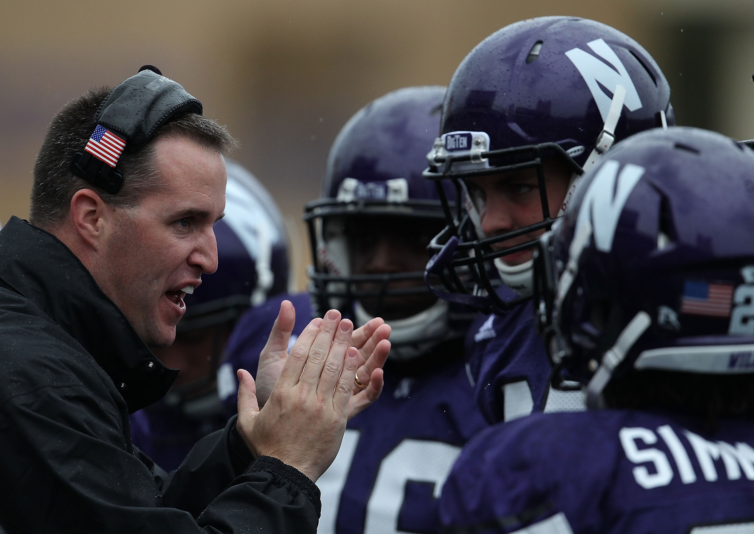 EVANSTON, IL - OCTOBER 23: Head coach Pat Fitzgerald of the Northwestern Wildcats encourages his team as they take on the Michigan State Spartans at Ryan Field on October 23, 2010 in Evanston, Illinois. Michigan State defeated Northwestern 35-27.  (Photo